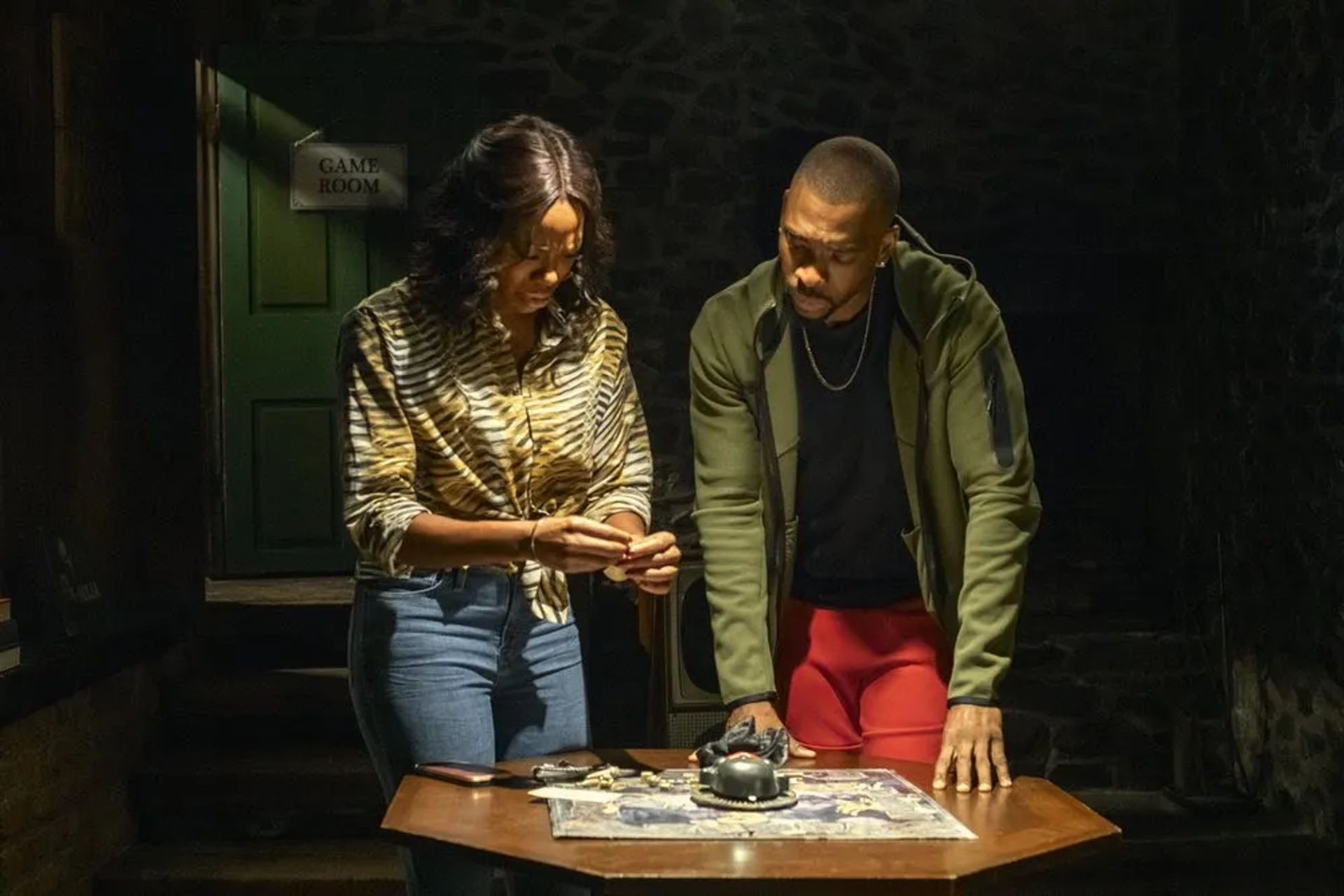 Jay Pharoah and Yvonne Orji in The Blackening (2022)