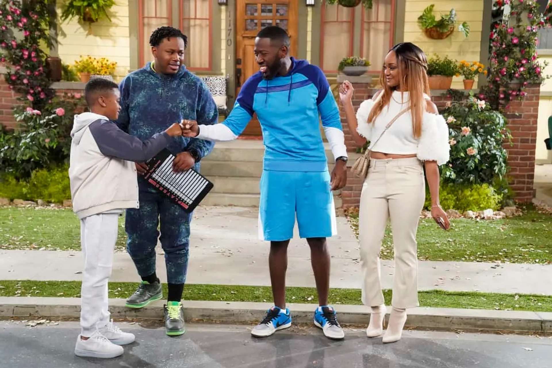 Jeremiah King, Sheaun McKinney, Kimberley Drummond, and Marcel Spears in The Neighborhood: Welcome to the Family Business (2021)