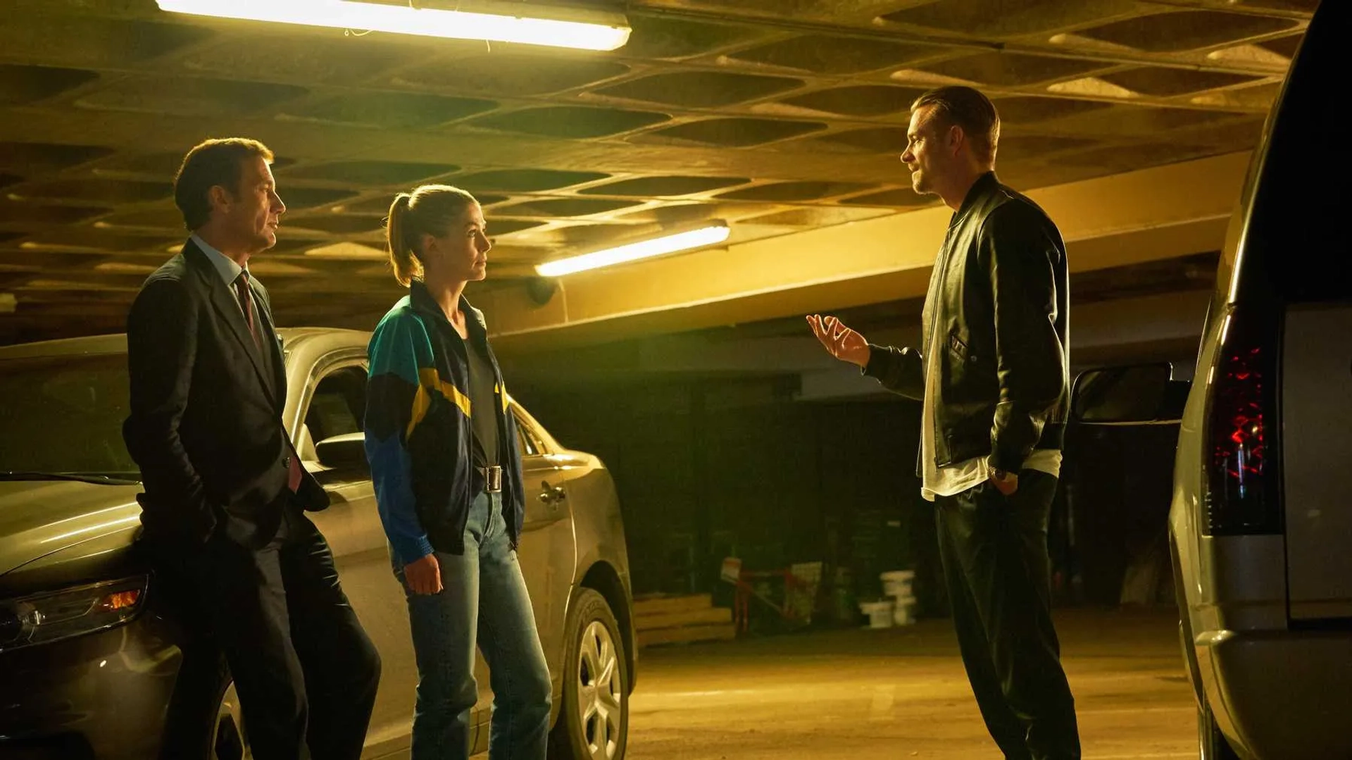 Clive Owen, Rosamund Pike, and Joel Kinnaman in The Informer (2019)