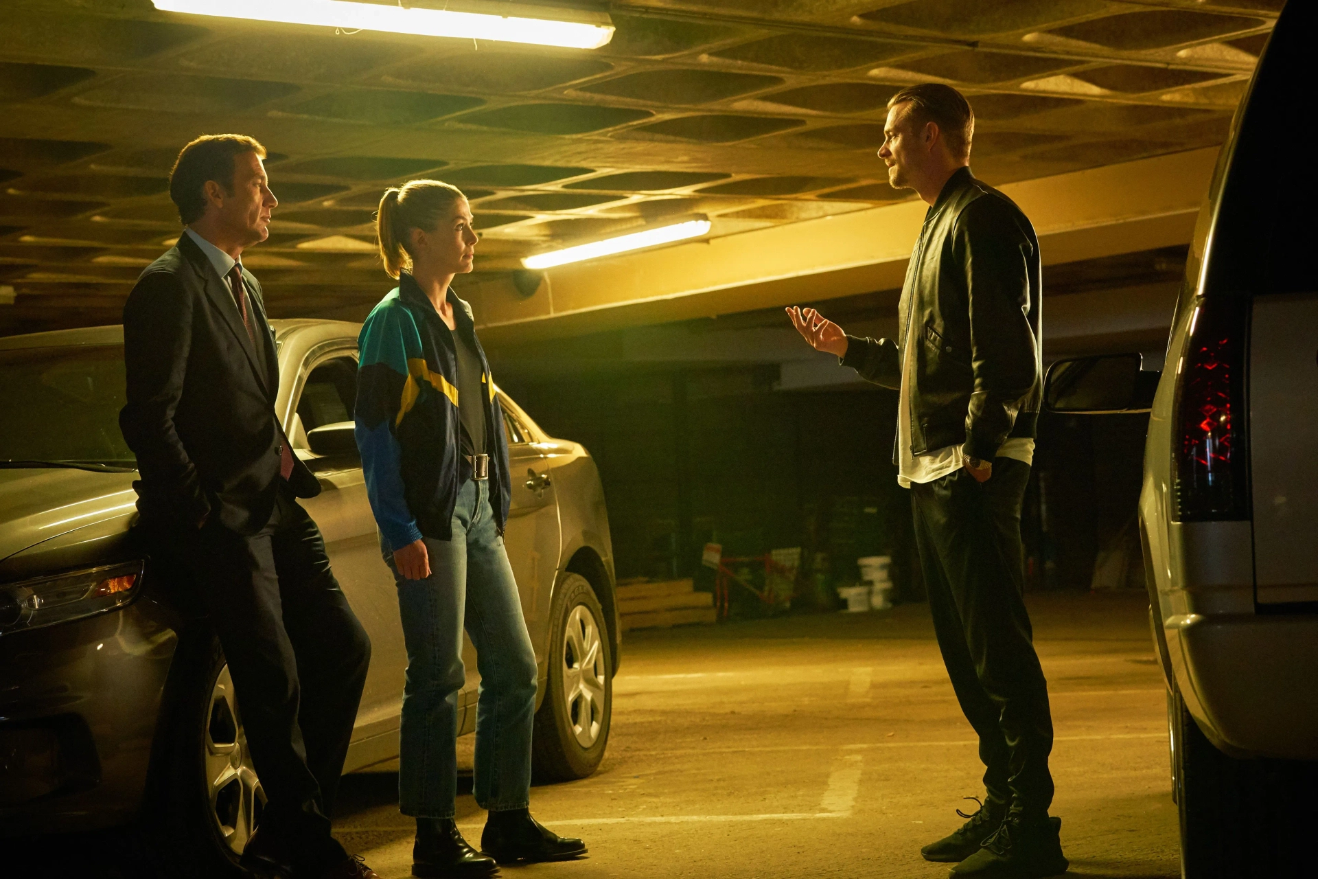 Clive Owen, Rosamund Pike, and Joel Kinnaman in The Informer (2019)