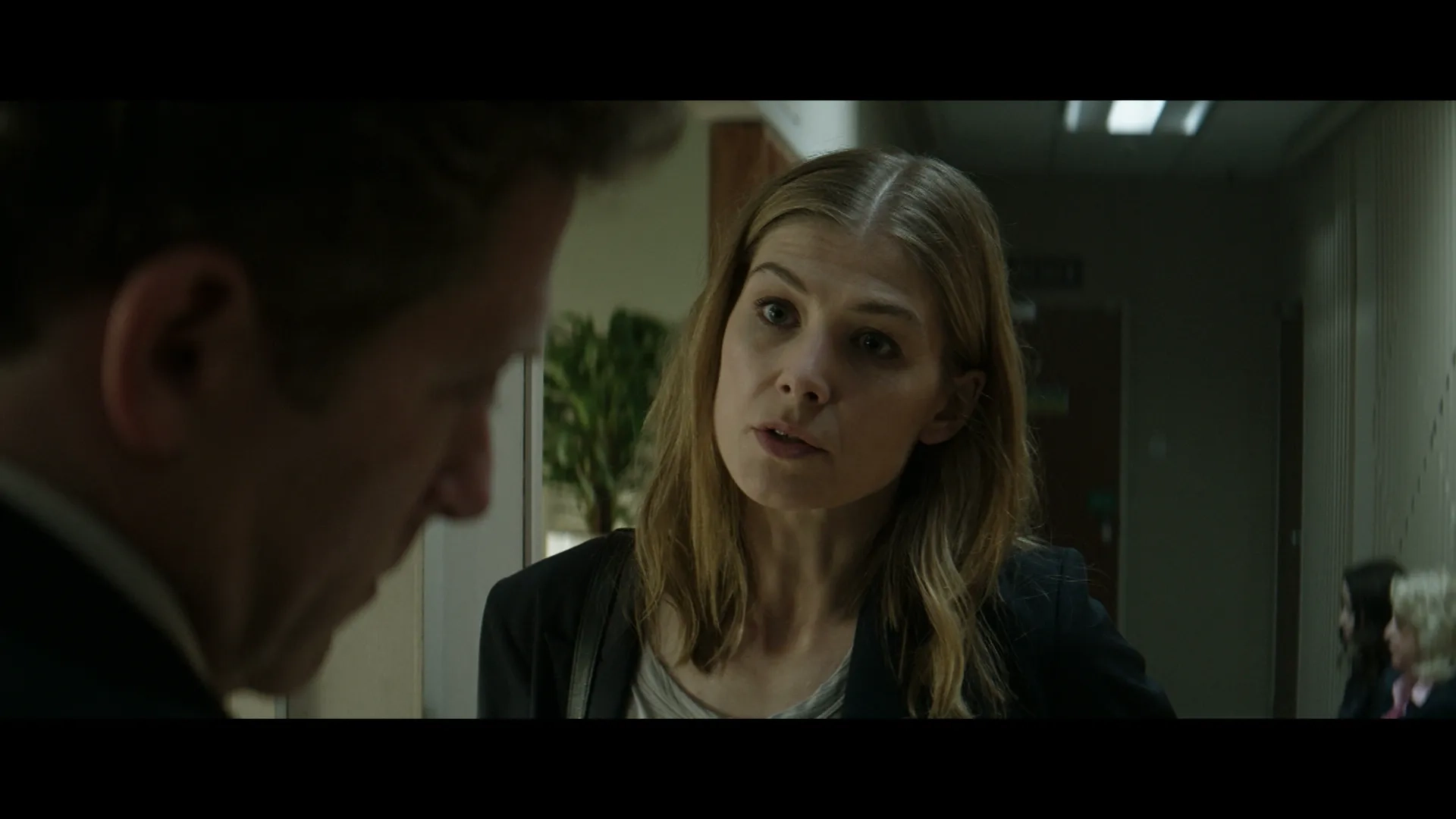 Rosamund Pike and Aylam Orian in The Informer (2019)