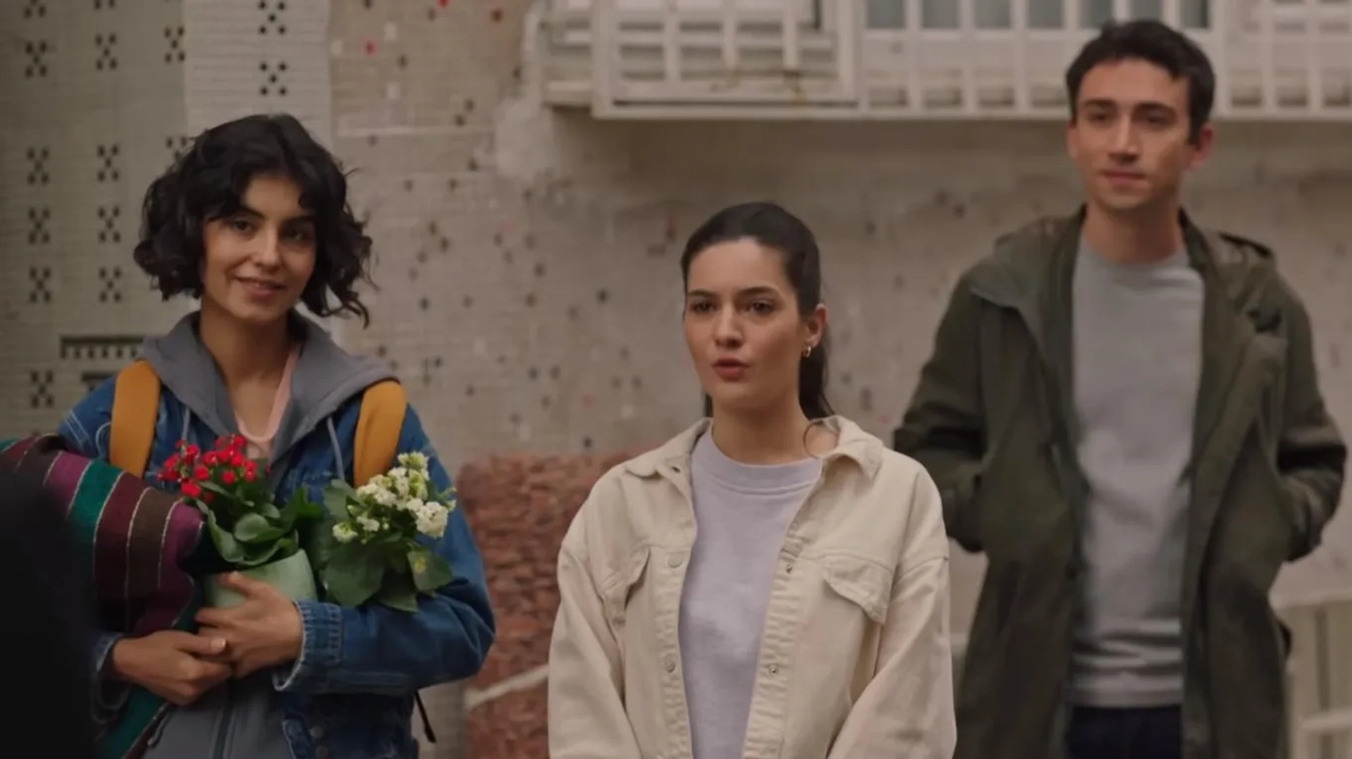 Rojbin Erden, Onur Özer, and Sanem Babi in Let Life Come as It Knows (2022)