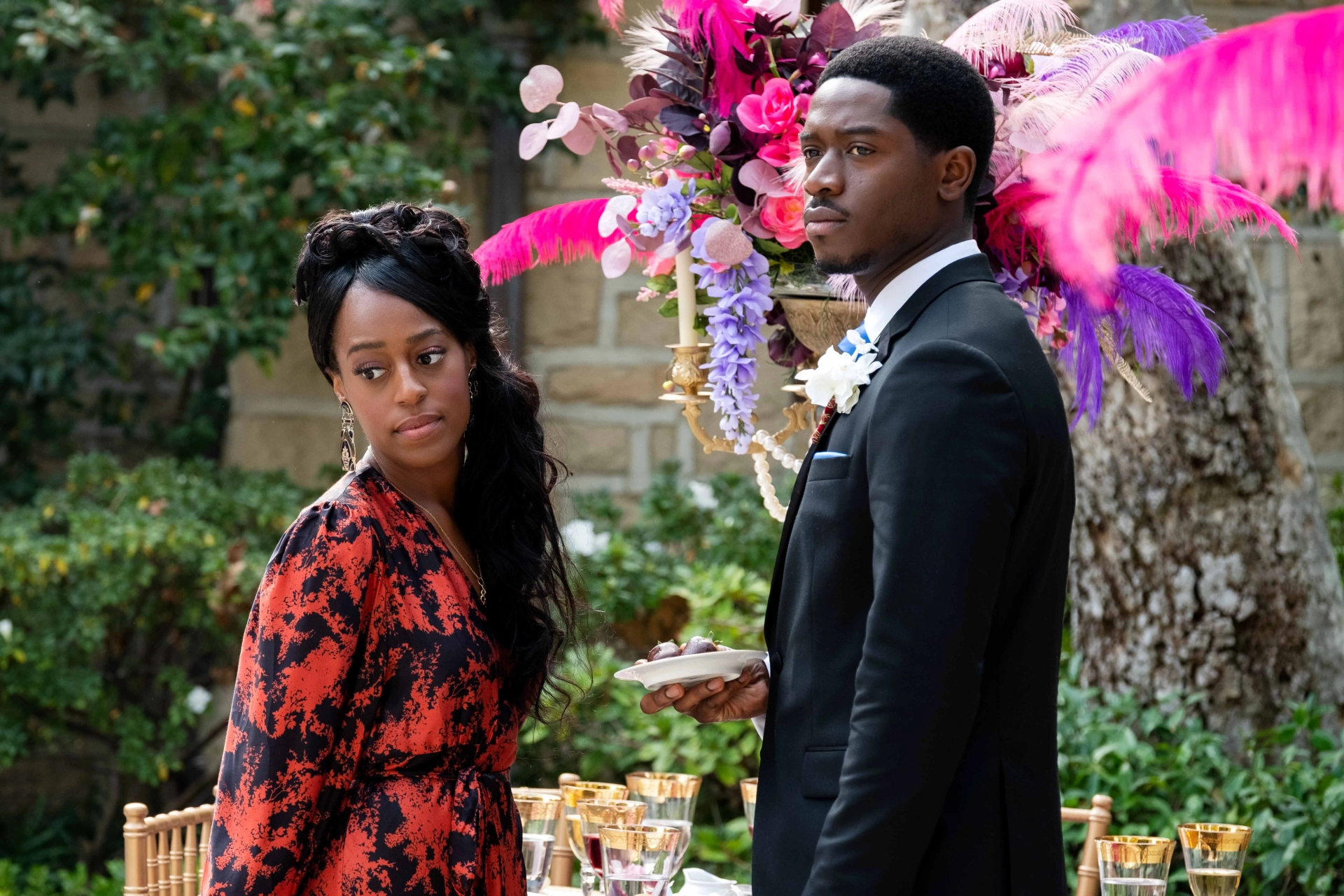 Devyn A. Tyler and Damson Idris in Snowfall: Celebration (2022)