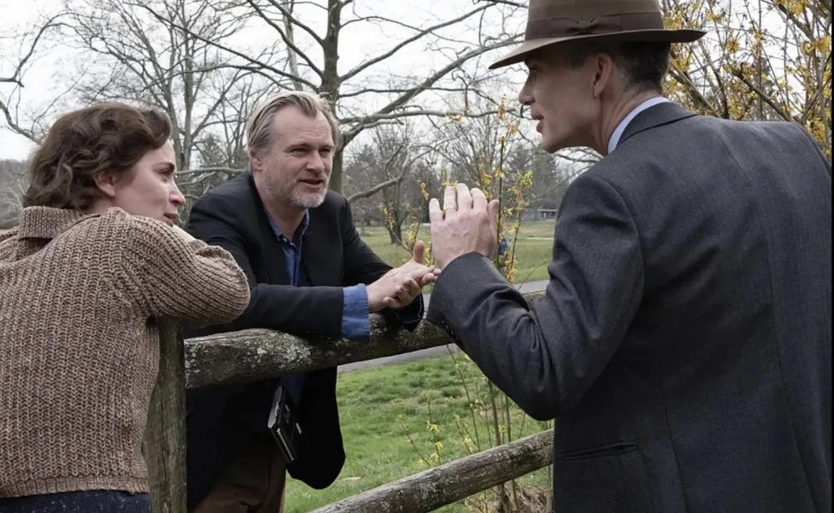 Cillian Murphy, Christopher Nolan, and Emily Blunt in Oppenheimer (2023)