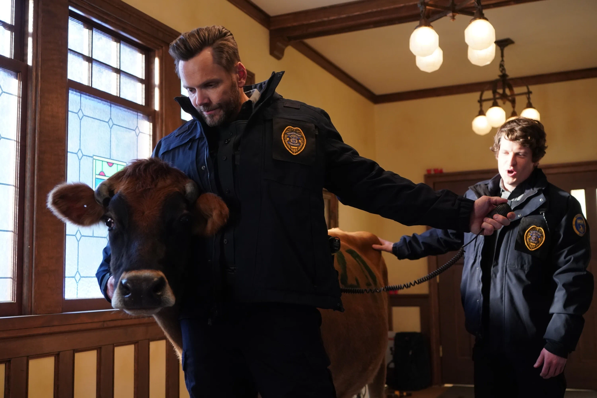 Joel McHale and Michael Rowland in Animal Control (2023)