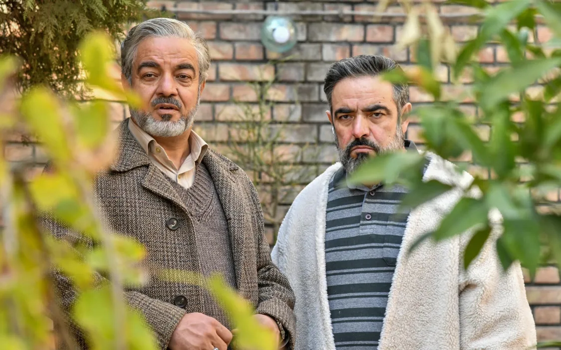 Mohammad Hassan Madjooni and Saeed Aghakhani in The Secret of Survival (2022)