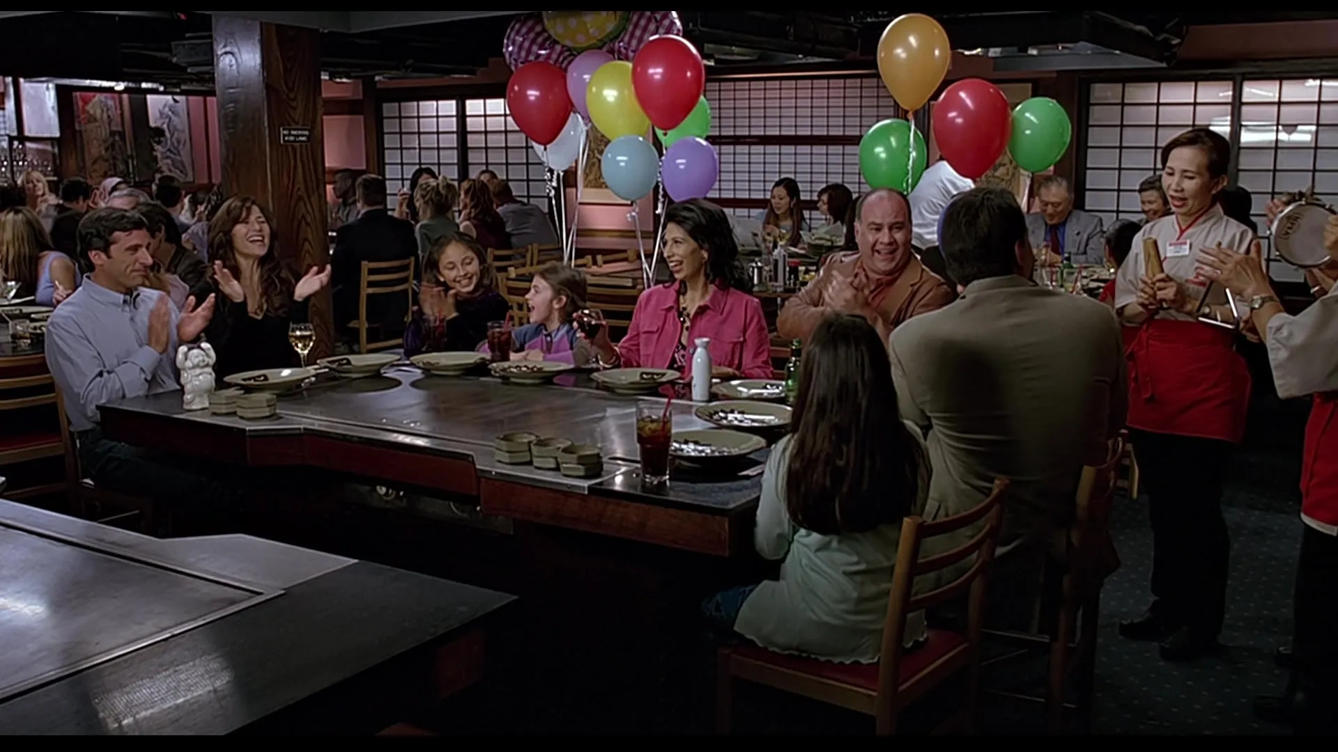 Catherine Keener, Rose Abdoo, Steve Bannos, Steve Carell, Brooke Hamlin, and Miyoko Shimosawa in The 40-Year-Old Virgin (2005)