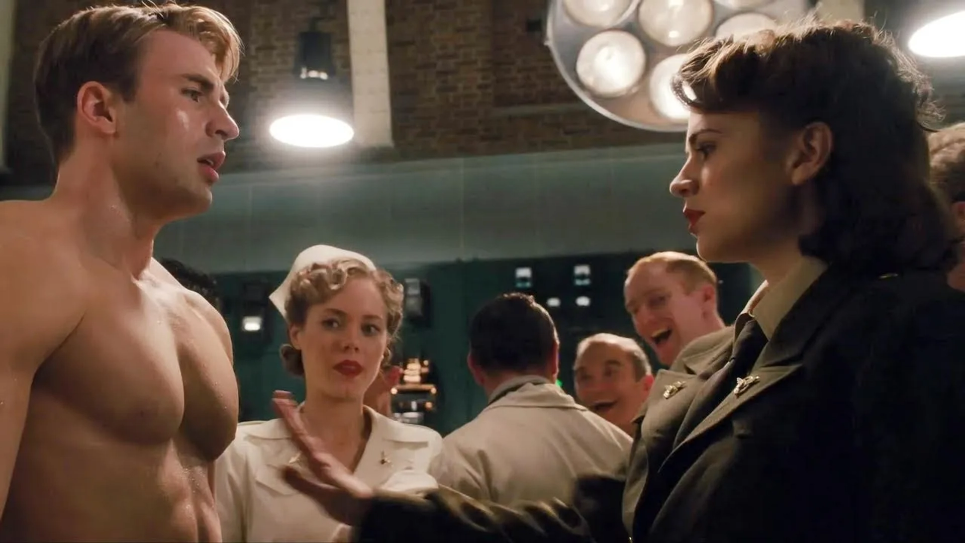 Chris Evans, Hayley Atwell, and Katherine Press in Captain America: The First Avenger (2011)