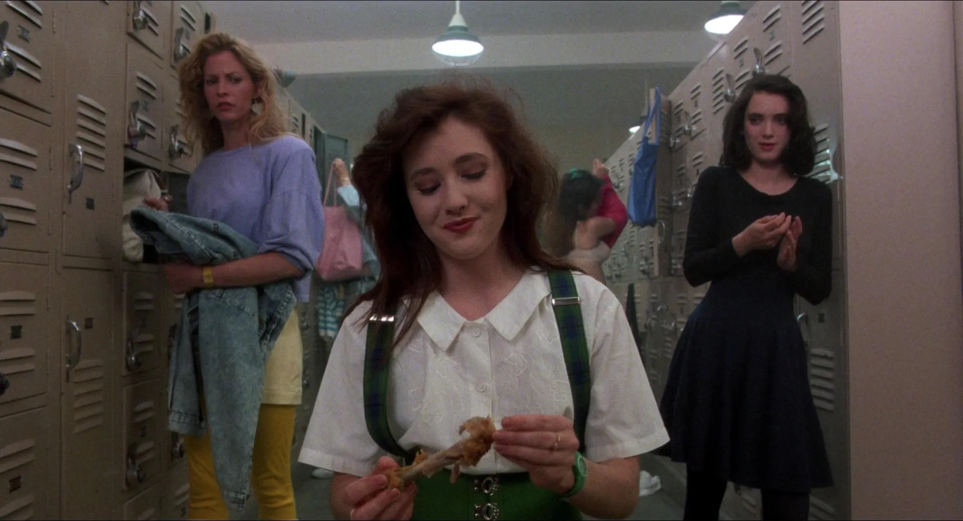 Winona Ryder, Shannen Doherty, and Lisanne Falk in Heathers (1988)