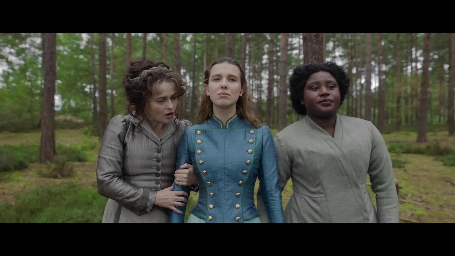 Helena Bonham Carter, Susan Wokoma, and Millie Bobby Brown in Enola Holmes 2 (2022)