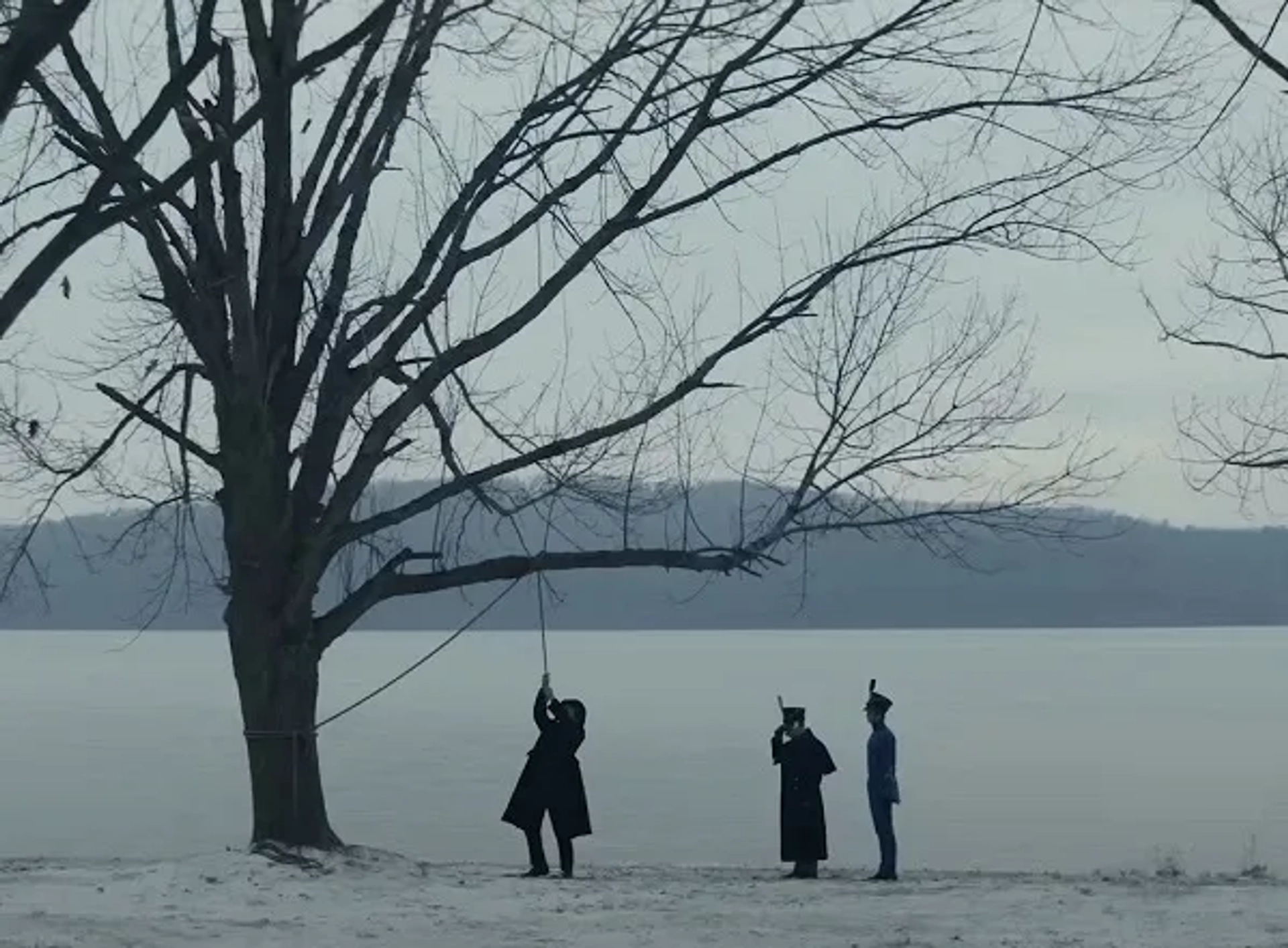 Christian Bale, Simon McBurney, and Brennan Keel Cook in The Pale Blue Eye (2022)