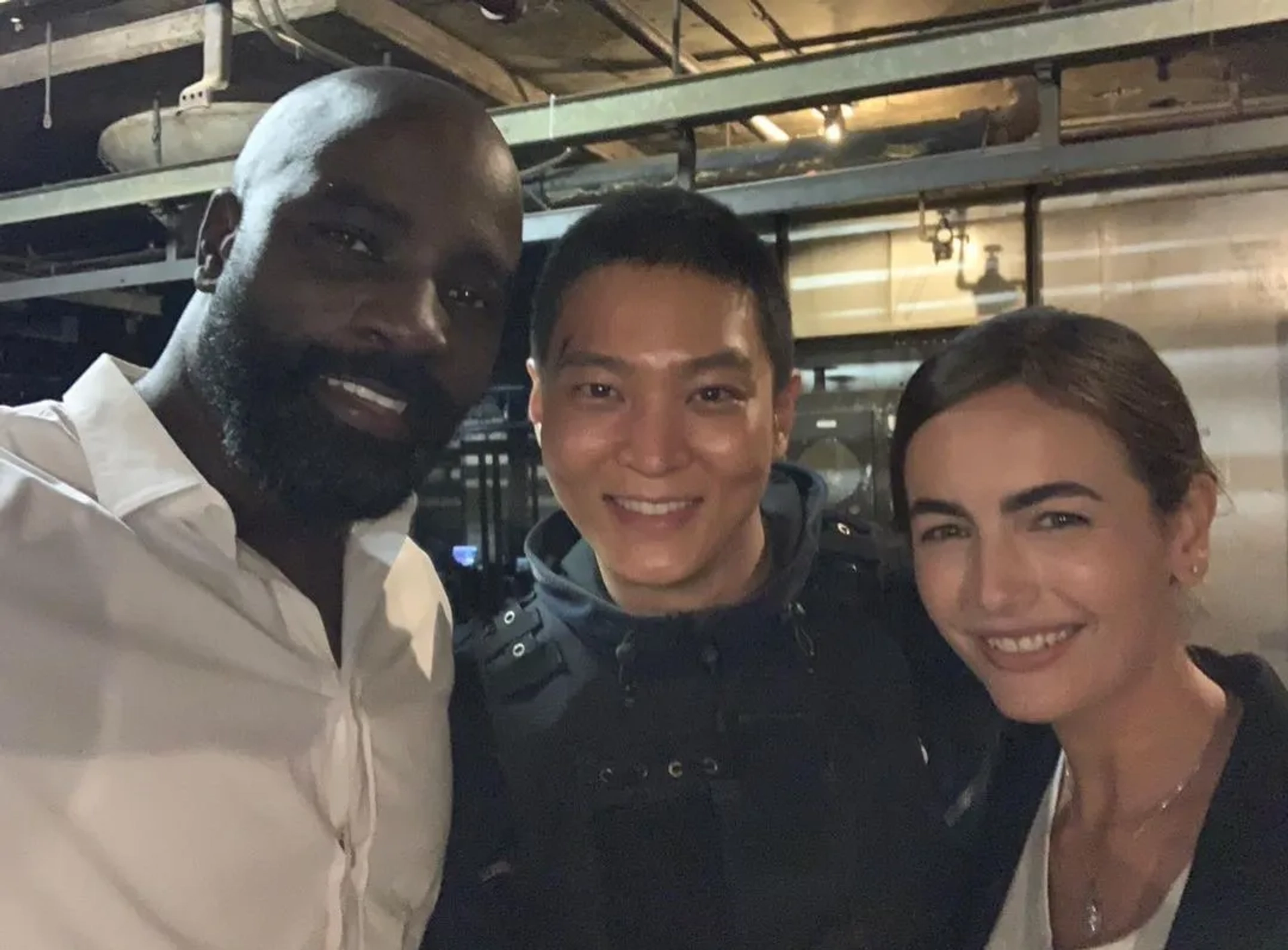 Camilla Belle, Mike Colter, and Joo Won in Carter (2022)