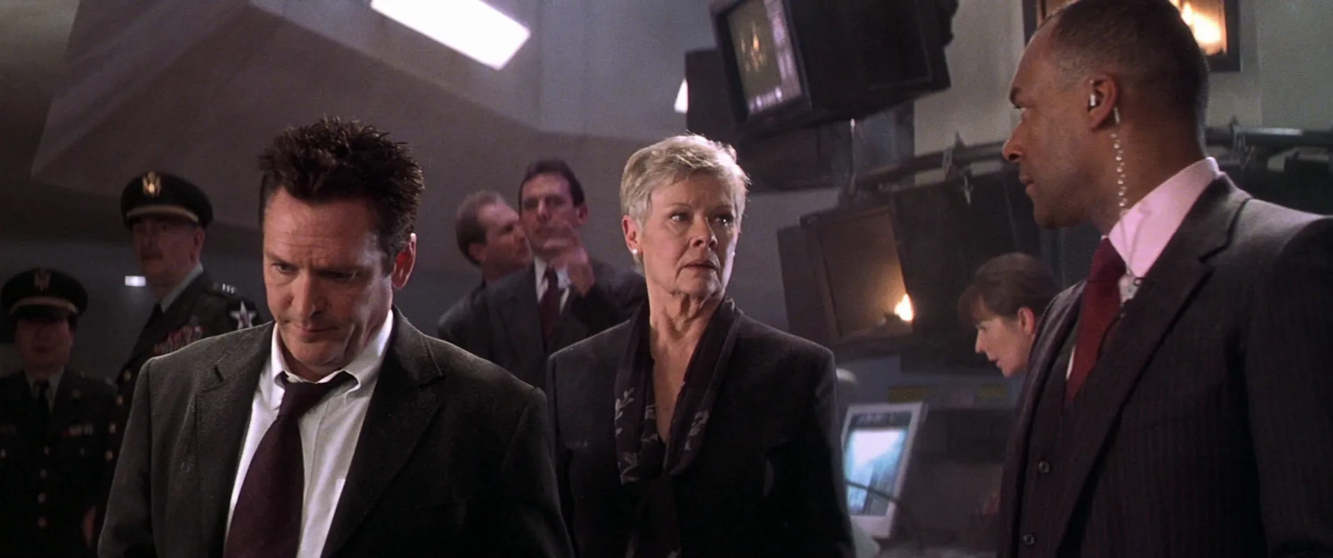 Michael Madsen, Judi Dench, Colin Salmon, and Michael G. Wilson in Die Another Day (2002)