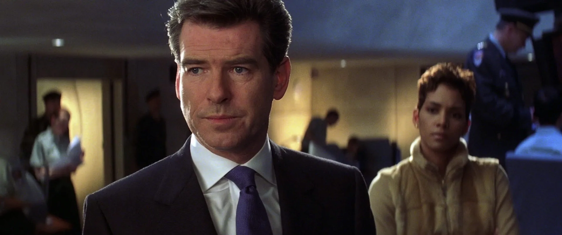 Pierce Brosnan, Halle Berry, and Michael G. Wilson in Die Another Day (2002)