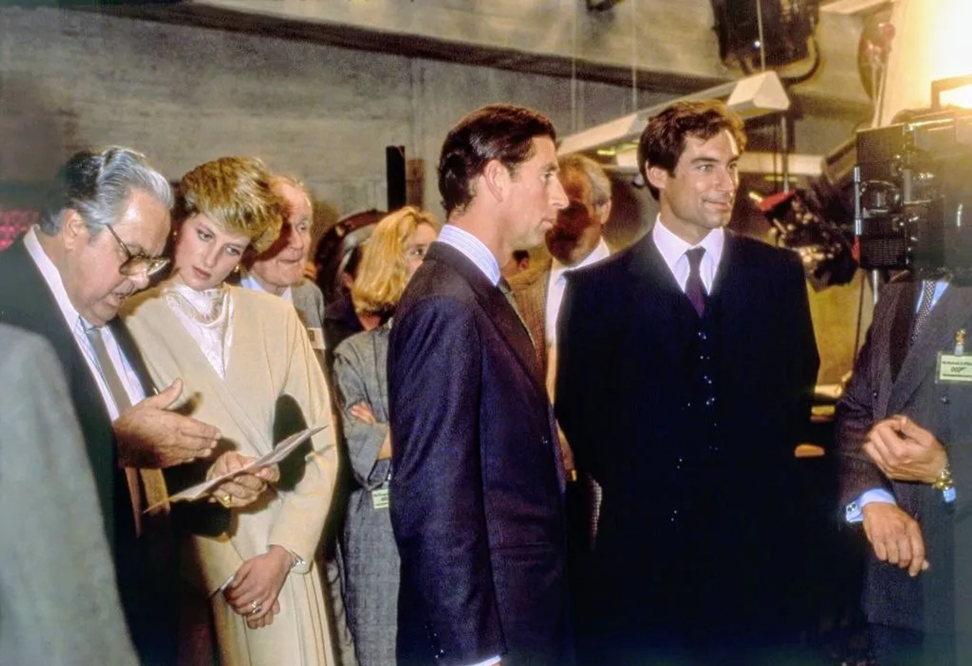 Timothy Dalton, Maryam d'Abo, Desmond Llewelyn, Albert R. Broccoli, John Glen, King Charles III, and Princess Diana in The Living Daylights (1987)