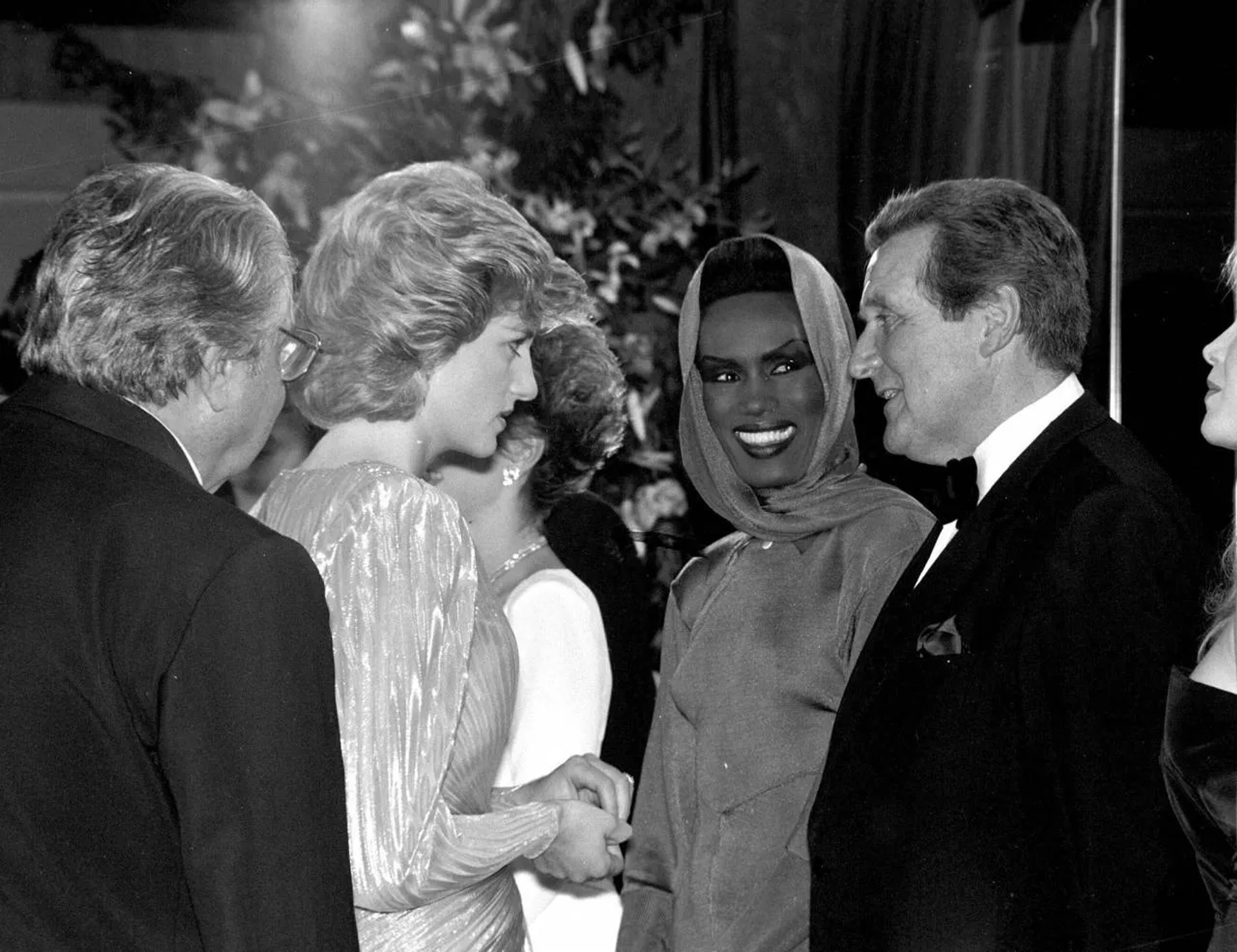 Roger Moore, Grace Jones, and Princess Diana at an event for A View to a Kill (1985)