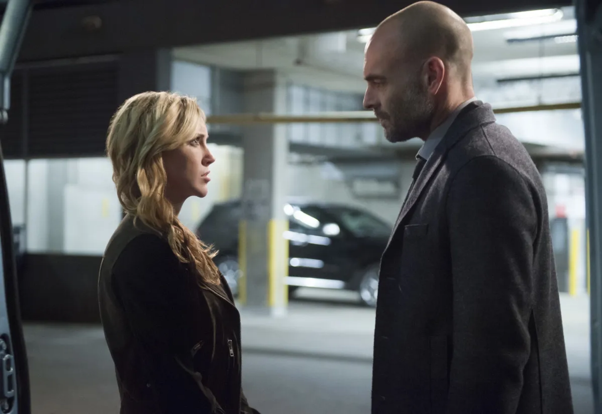 Paul Blackthorne and Katie Cassidy in Arrow (2012)