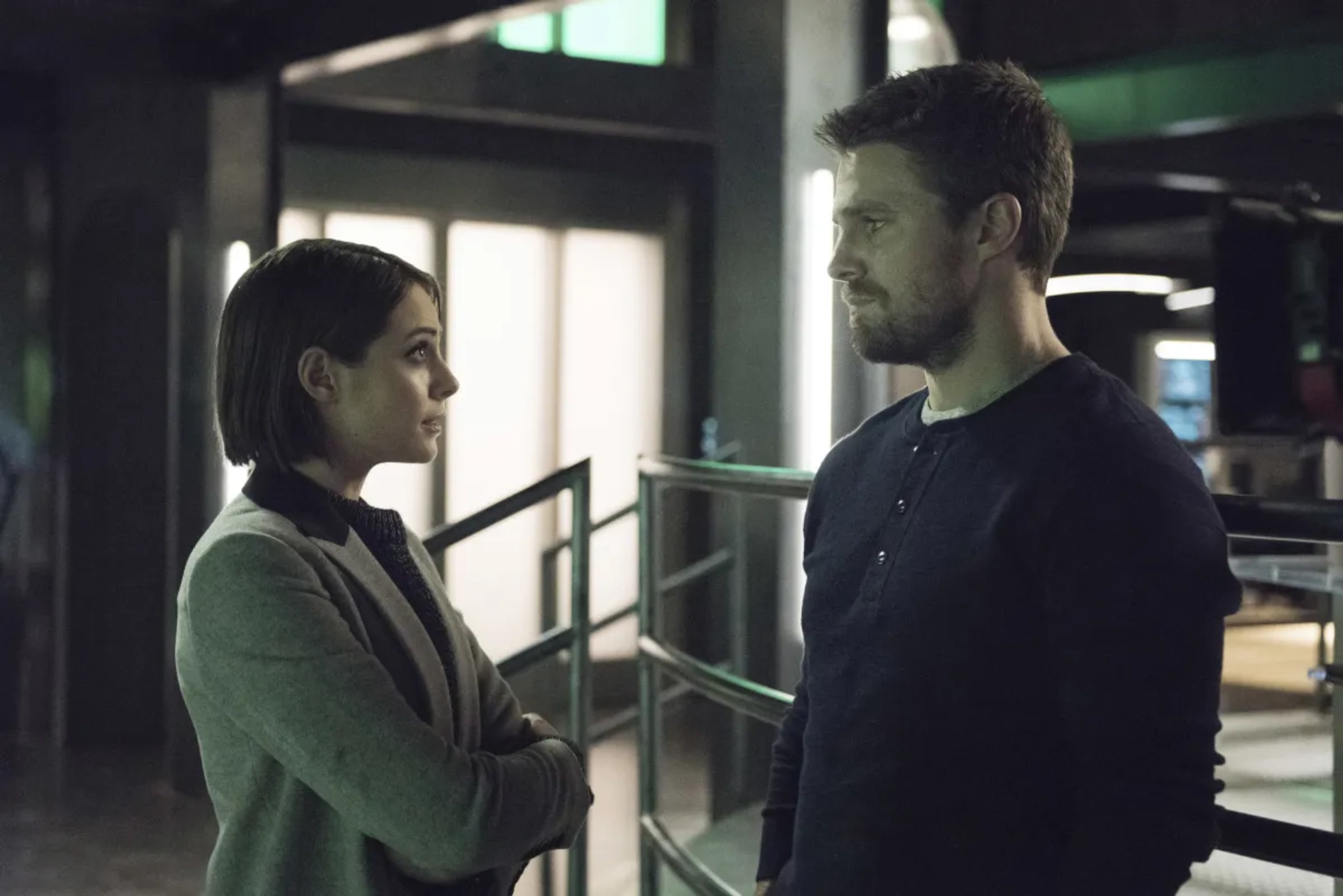 Willa Holland and Stephen Amell in Arrow (2012)