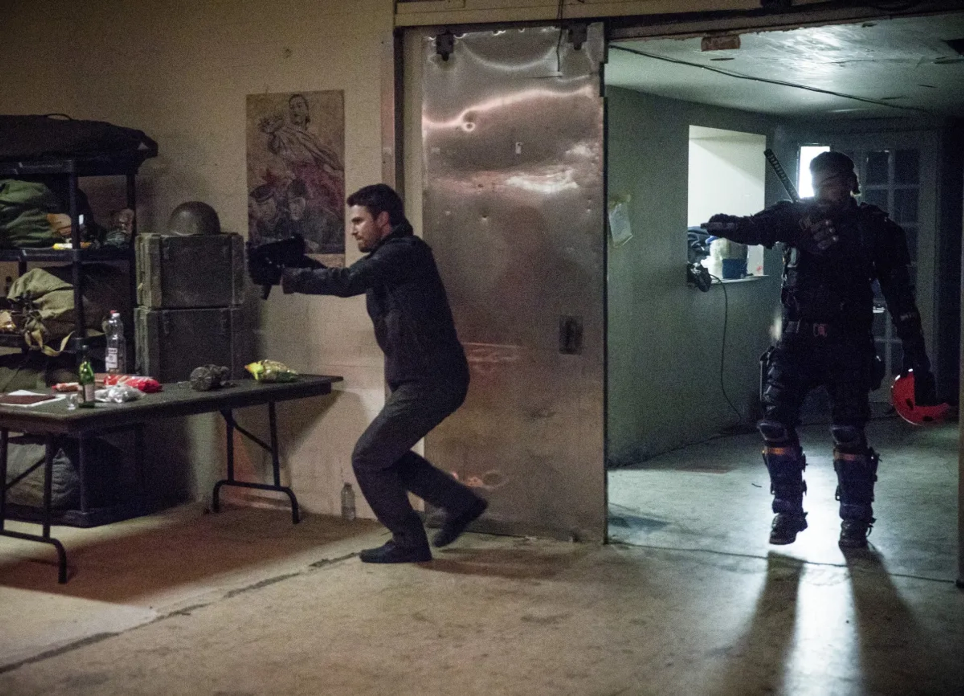 Manu Bennett and Stephen Amell in Arrow (2012)