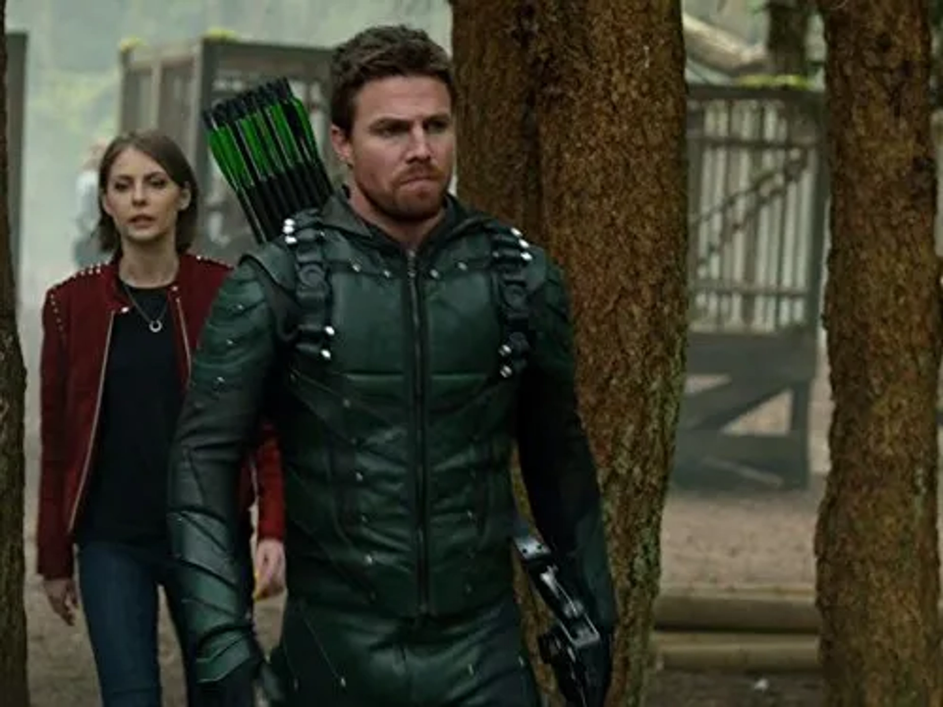 Willa Holland and Stephen Amell in Arrow (2012)