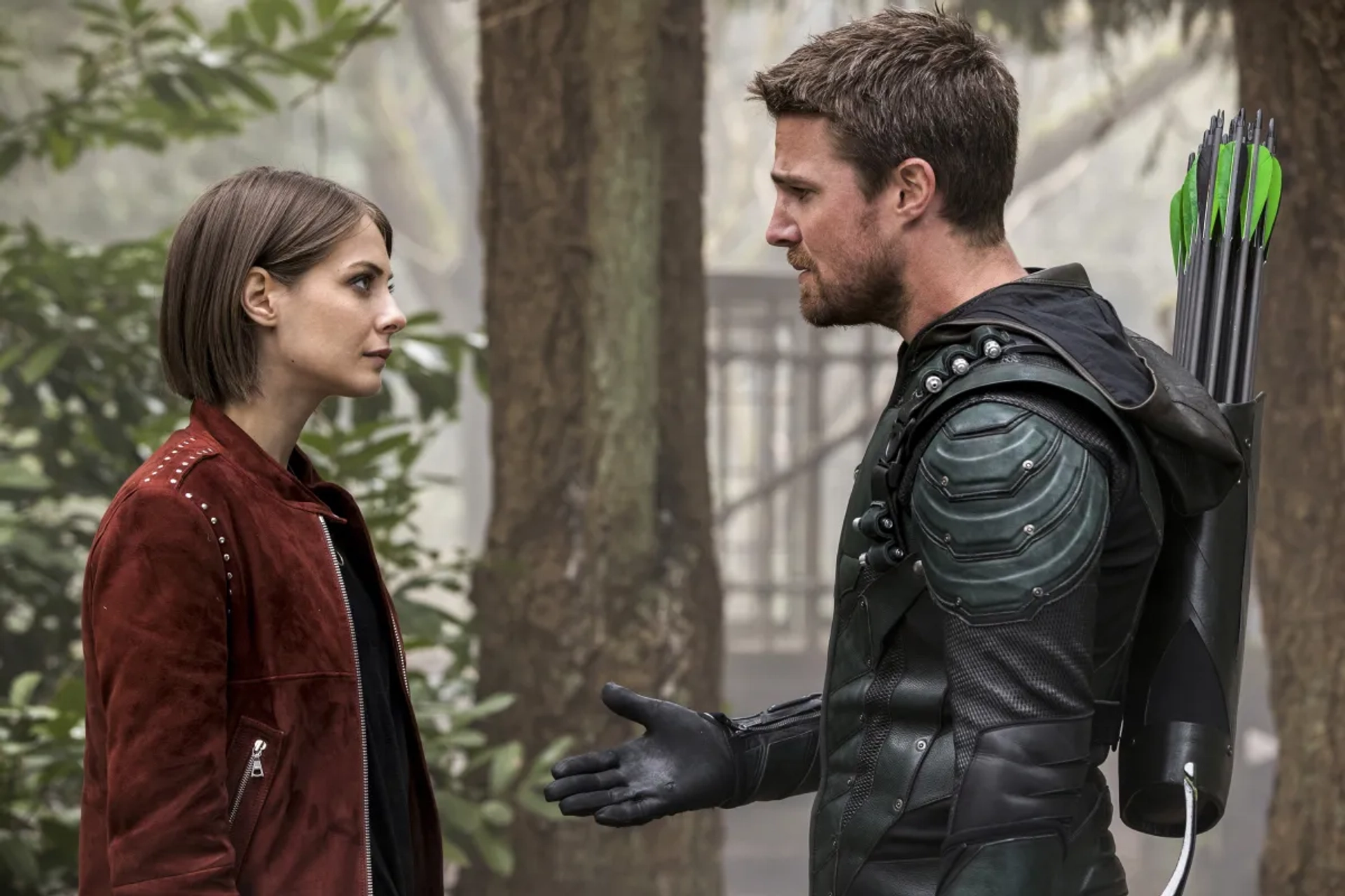 Willa Holland and Stephen Amell in Arrow (2012)