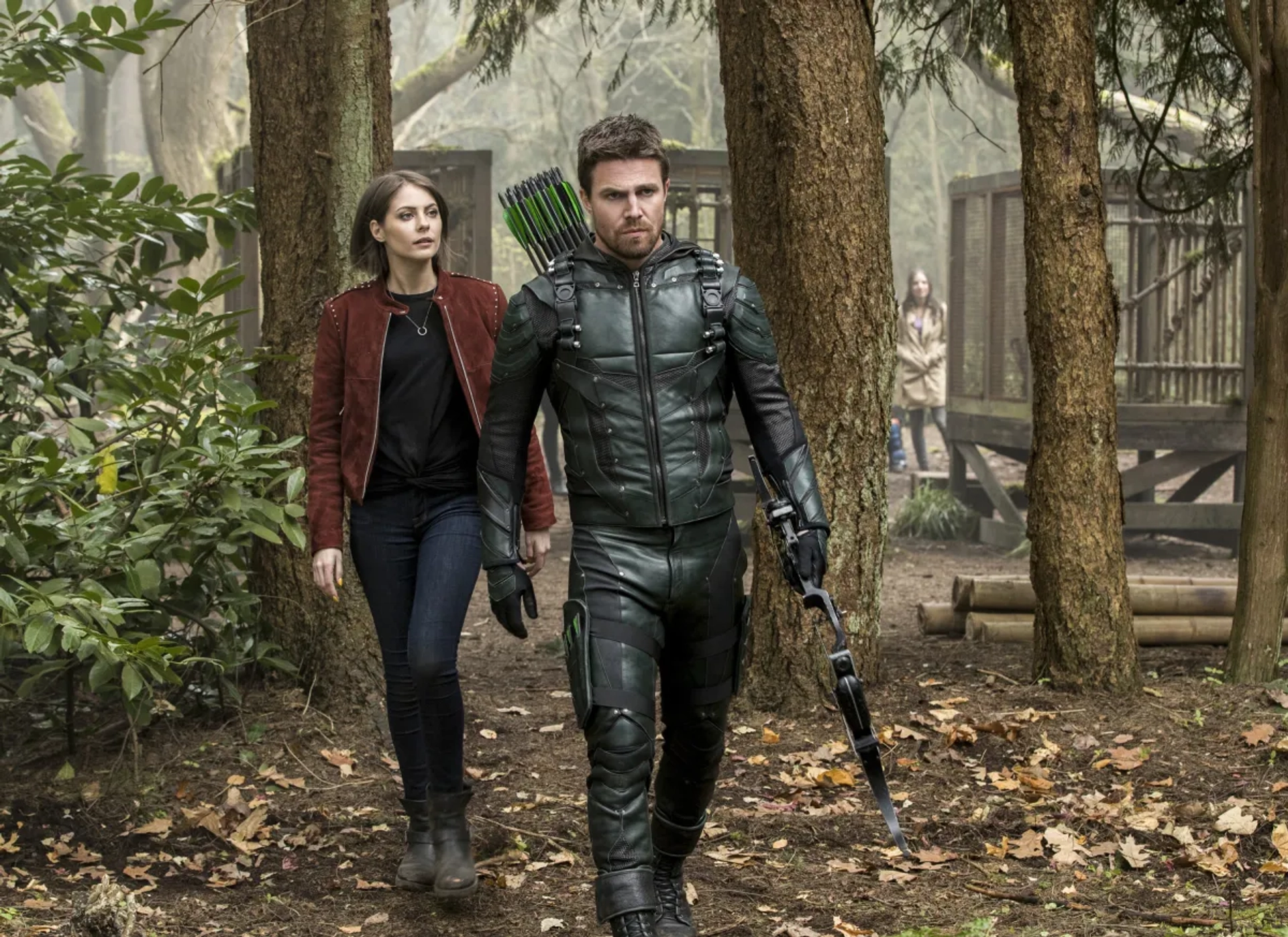 Willa Holland and Stephen Amell in Arrow (2012)