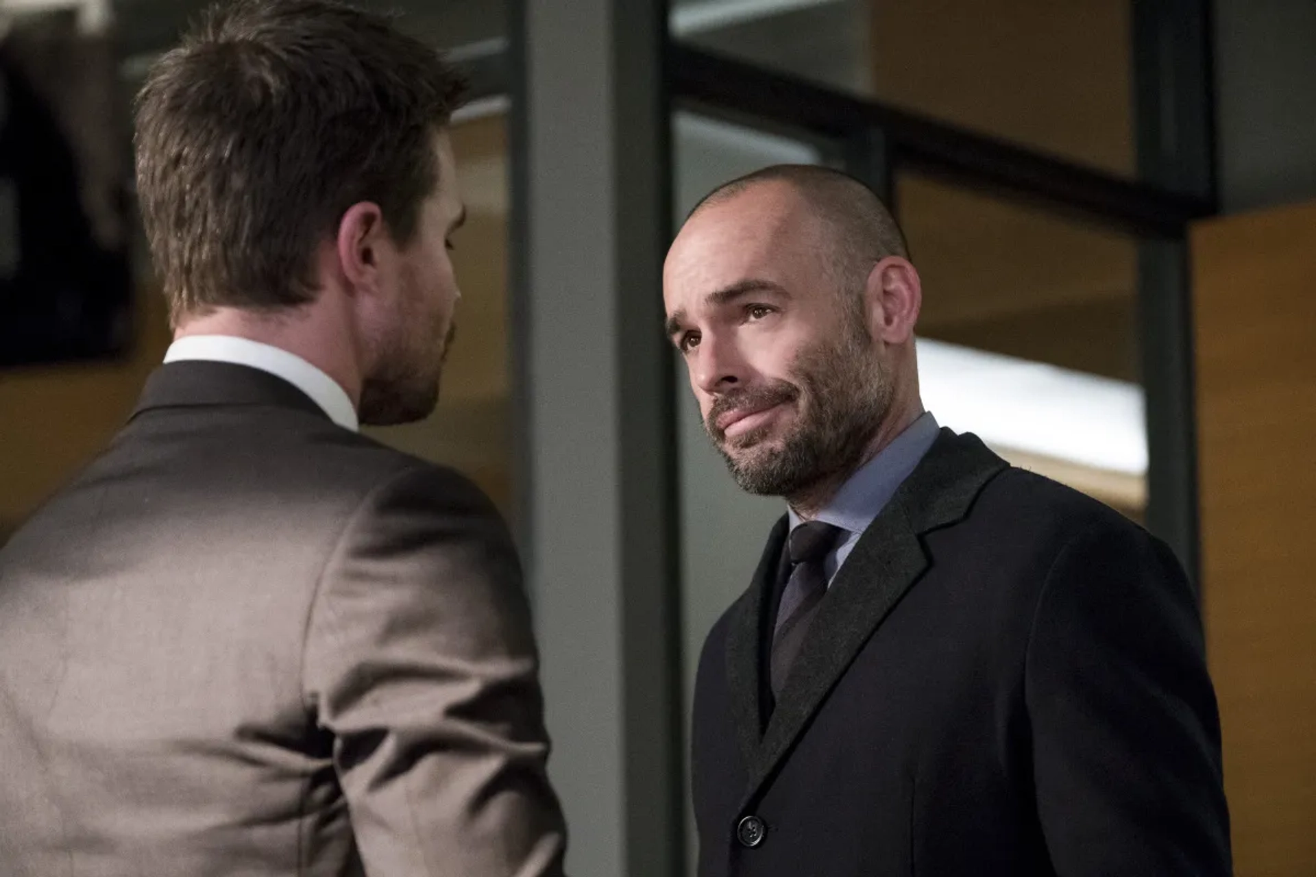 Paul Blackthorne and Stephen Amell in Arrow (2012)