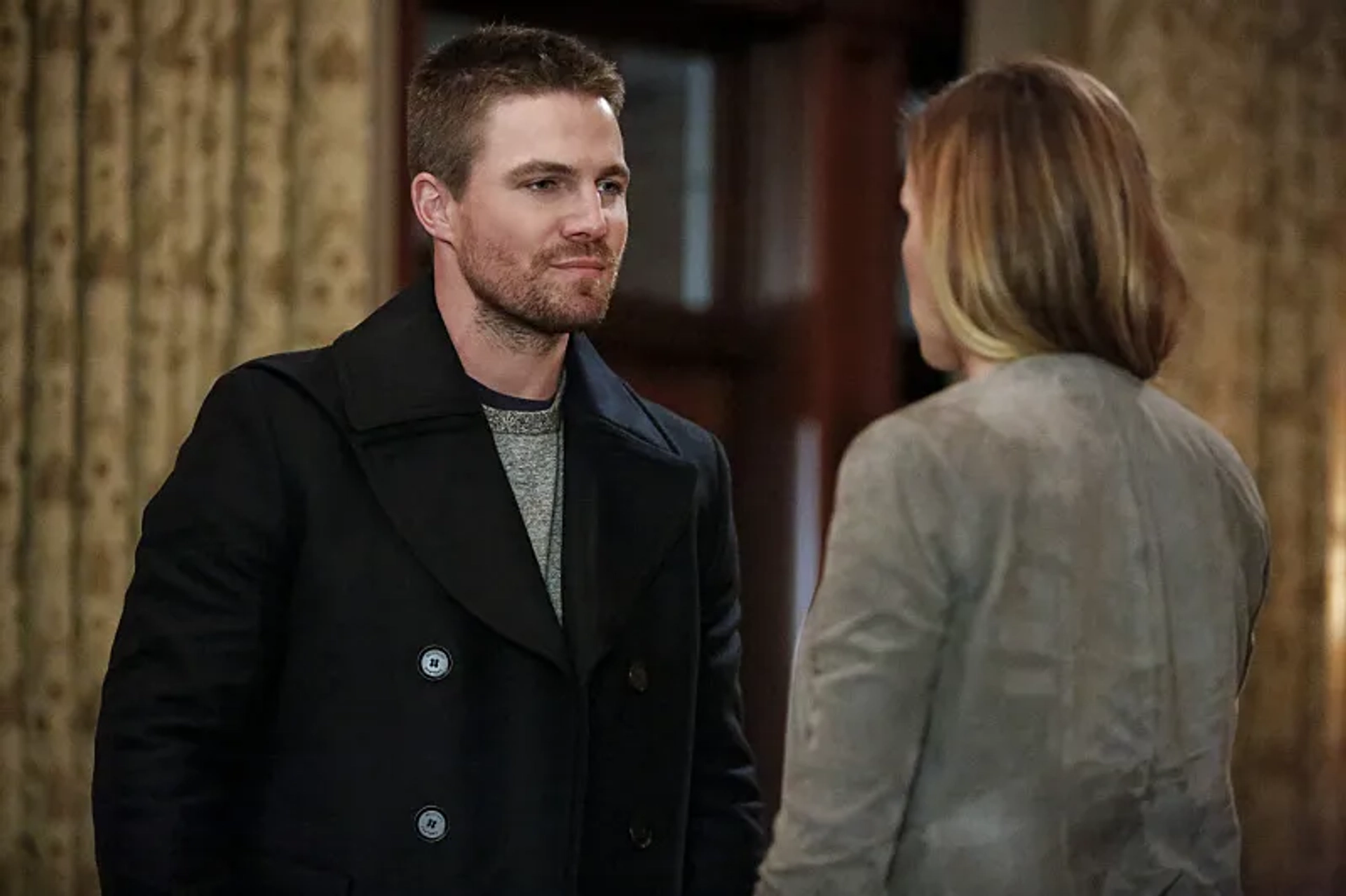 Katie Cassidy and Stephen Amell in Arrow (2012)