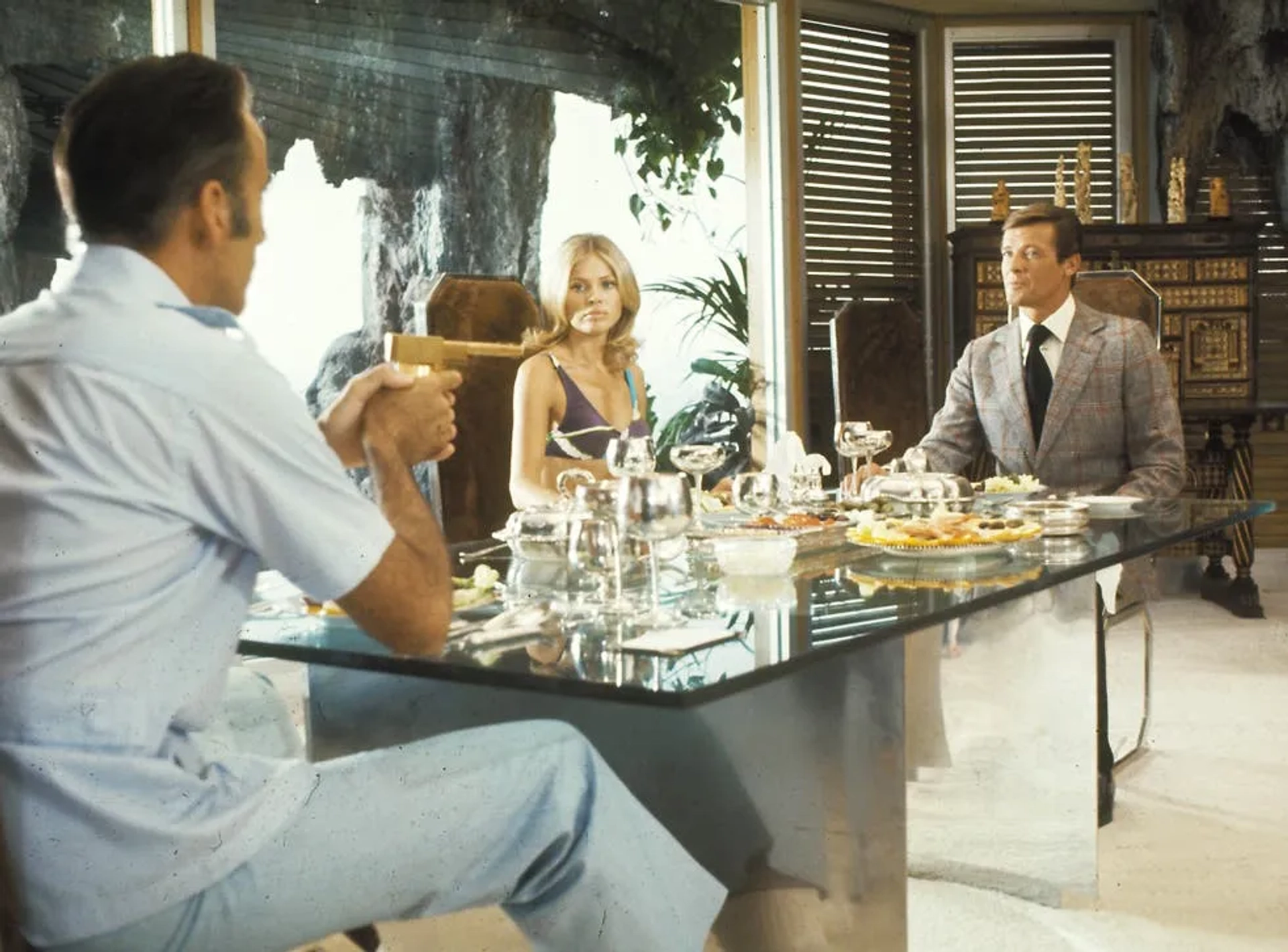 Christopher Lee, Roger Moore, and Britt Ekland in The Man with the Golden Gun (1974)