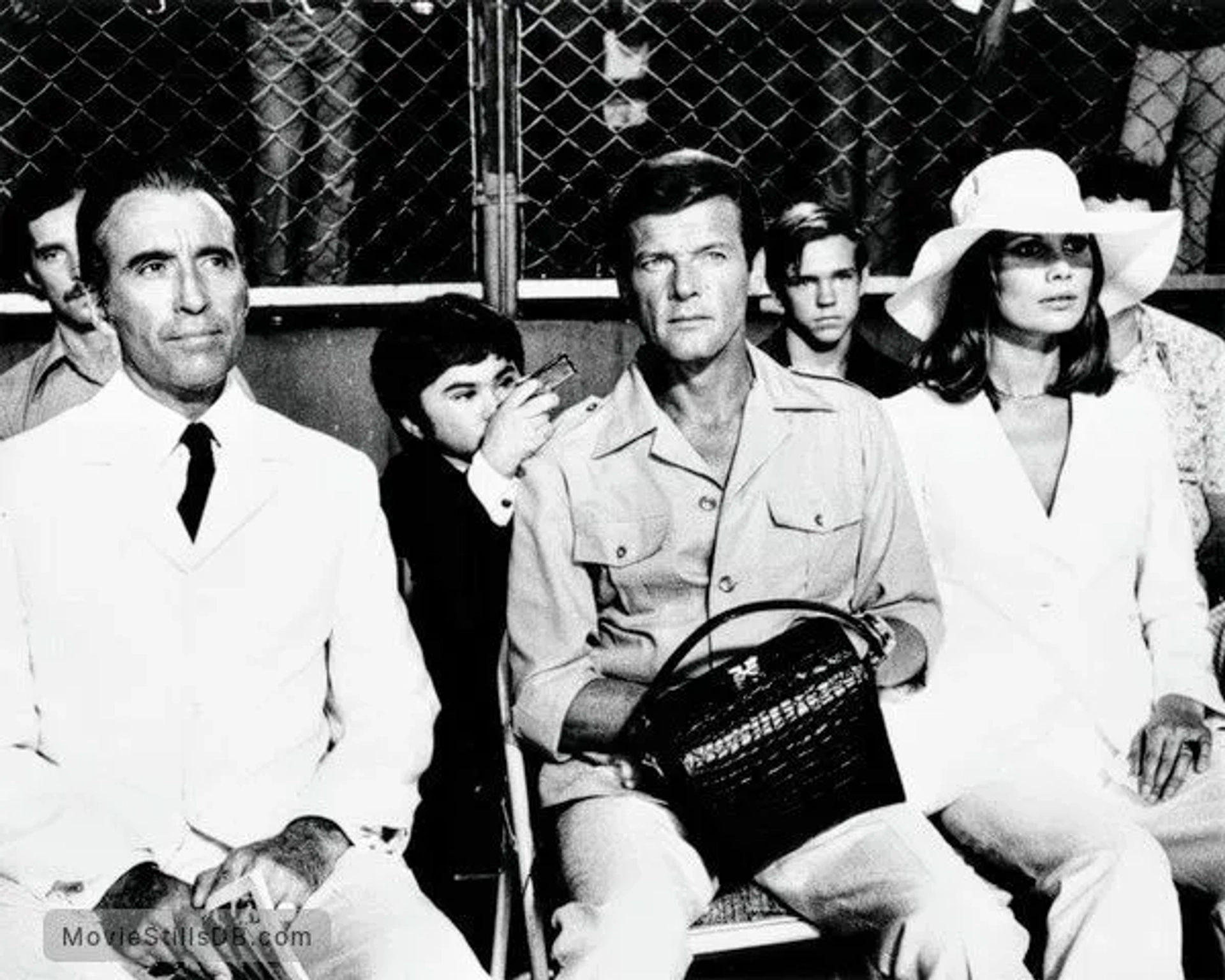 Christopher Lee, Roger Moore, Maud Adams, and Hervé Villechaize in The Man with the Golden Gun (1974)