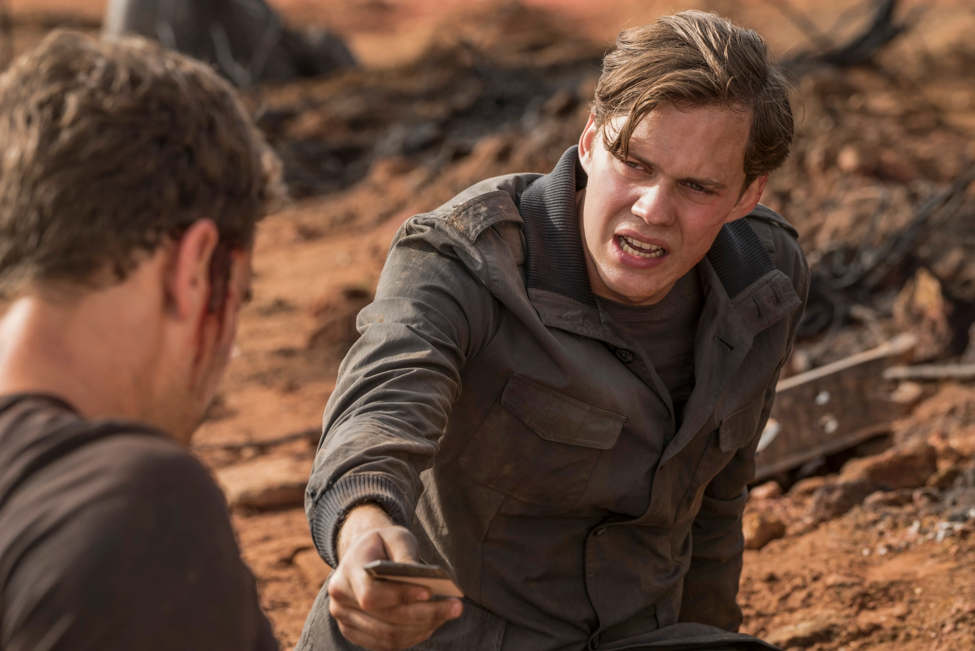 Bill Skarsgård and Theo James in Allegiant (2016)