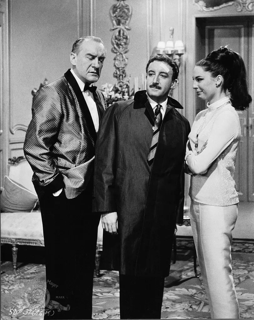 Peter Sellers, George Sanders, and Tracy Reed in A Shot in the Dark (1964)