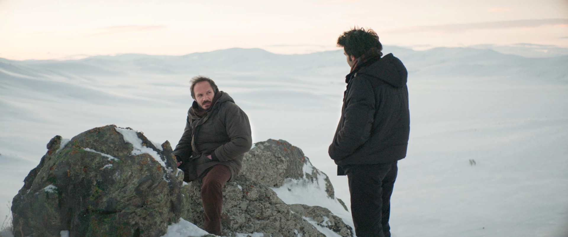 Deniz Celiloglu and Musab Ekici in About Dry Grasses (2023)