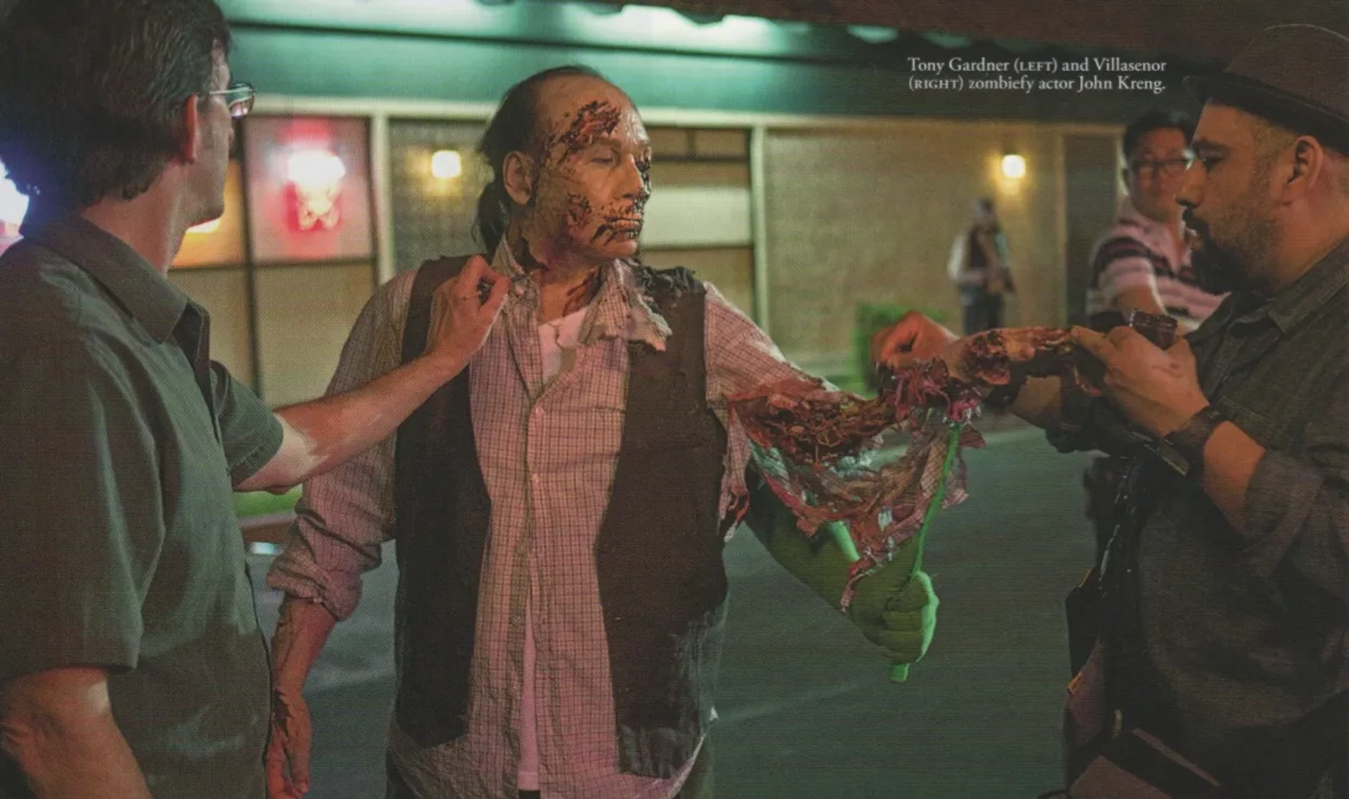 Actor John Kreng gets touched up by MFX Designer/Supervisor Tony Gardner (L) and MFX Dept. Head Hugo Villasenor (R) on location for Paramount's "Scouts Guide to the Zombie Apocalypse."