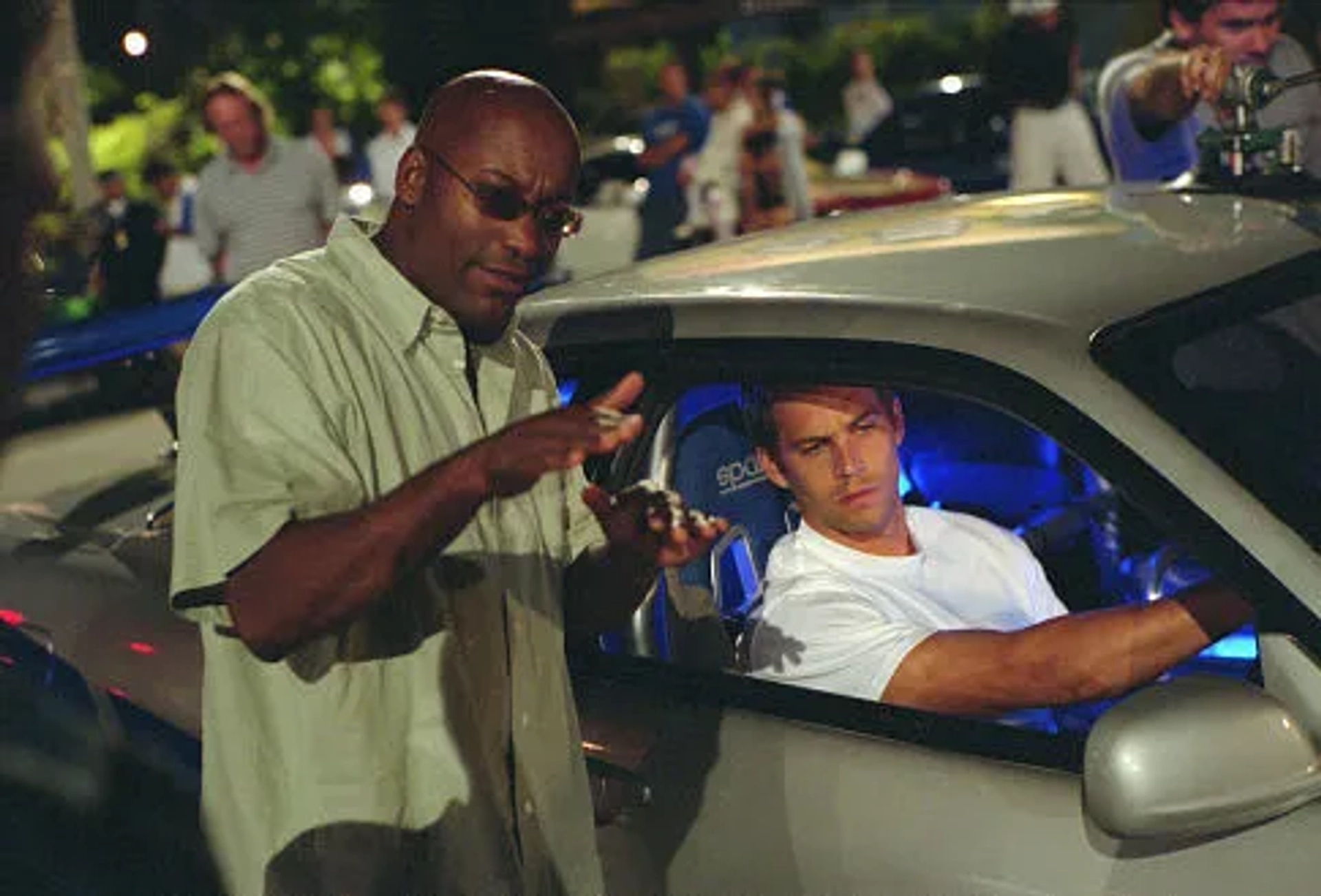 John Singleton and Paul Walker in 2 Fast 2 Furious (2003)