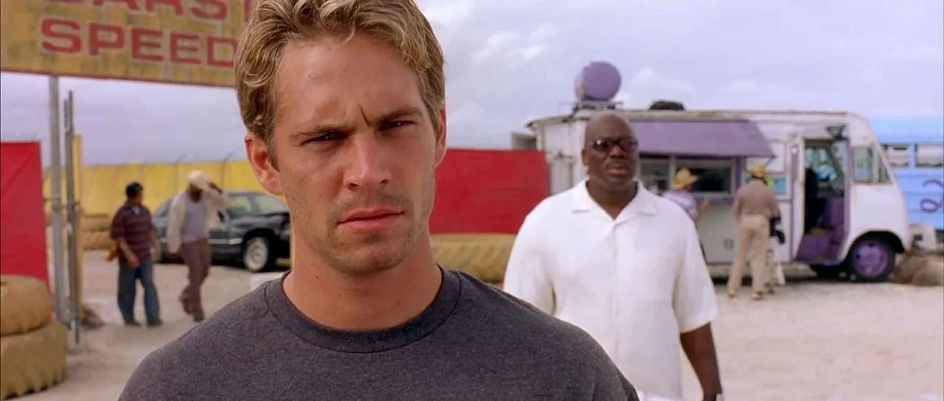 Thom Barry and Paul Walker in 2 Fast 2 Furious (2003)