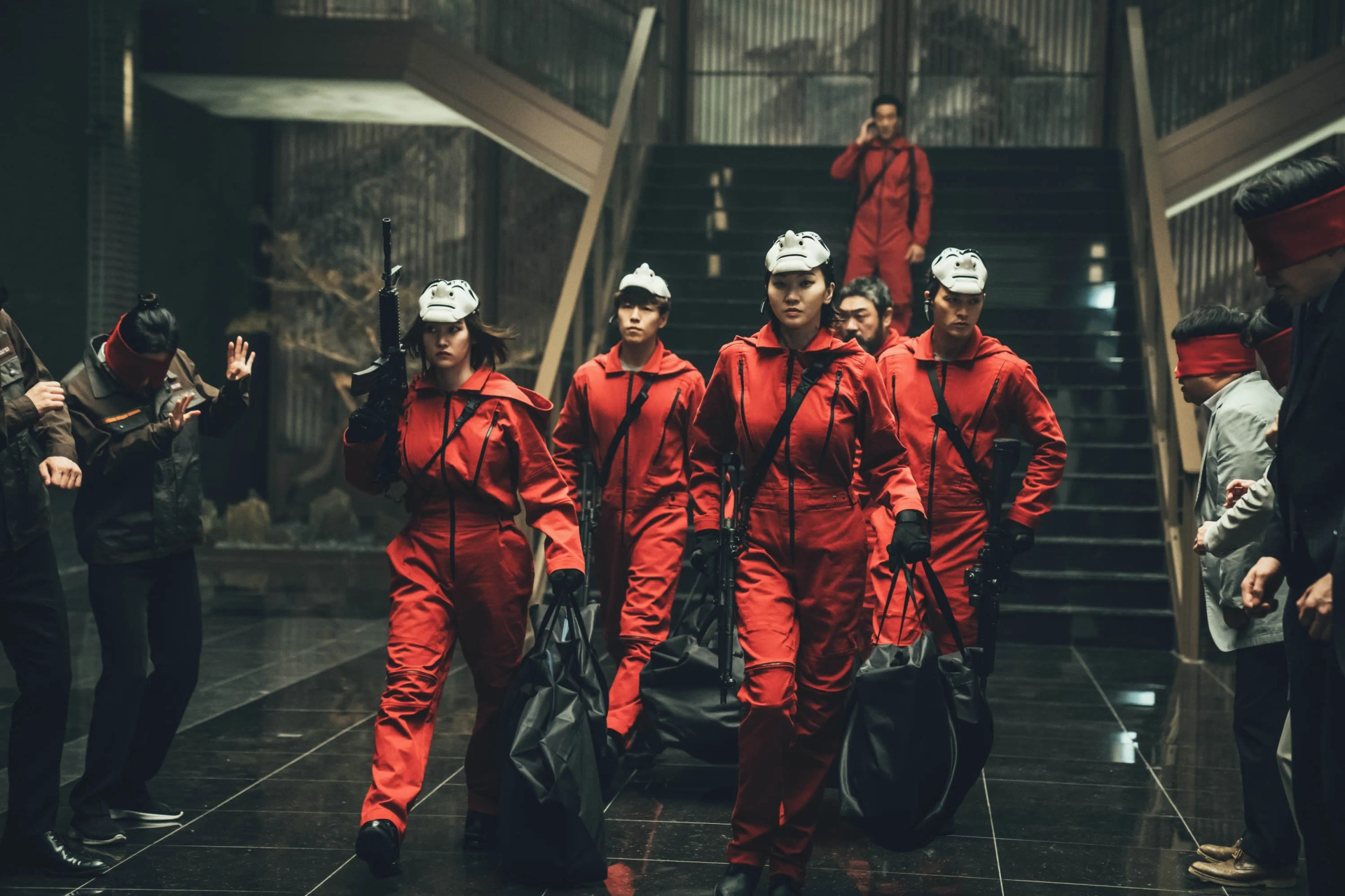 Nairobi, Lee Won-Jong, Jang Yoon-ju, Moscow, Ji Hun Kim, Park Hae-soo, and Lee Hyun-woo in Money Heist: Korea - Joint Economic Area (2022)