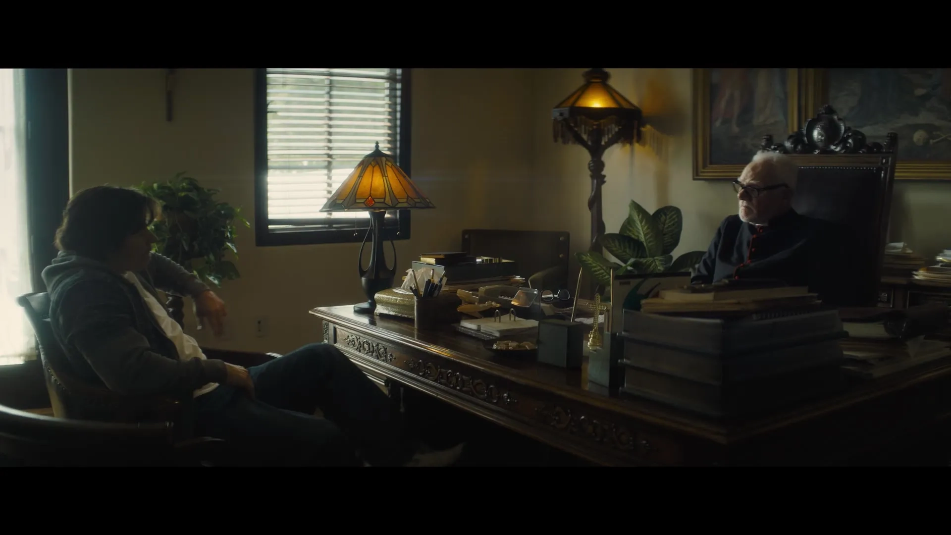 Mark Wahlberg and Malcolm McDowell in Father Stu (2022)