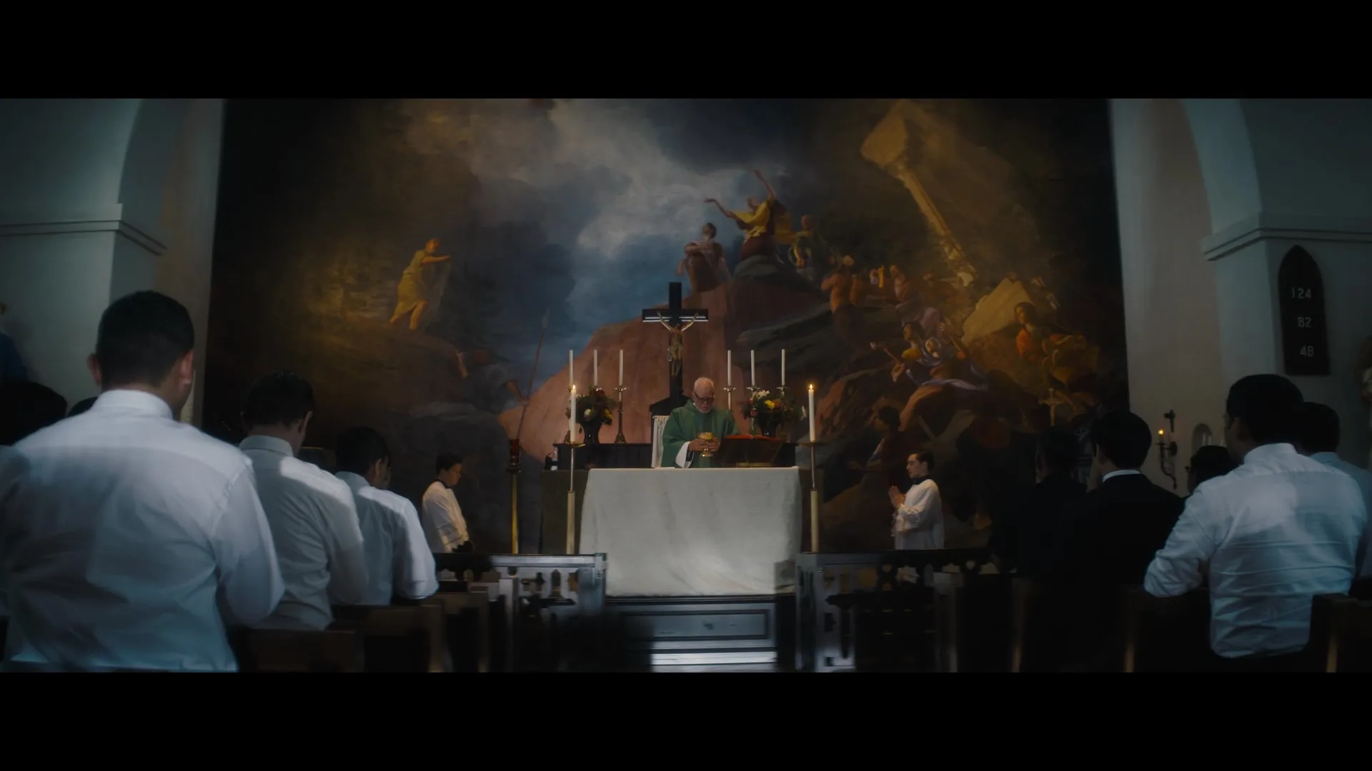 Mark Wahlberg, Malcolm McDowell, and Cody Fern in Father Stu (2022)