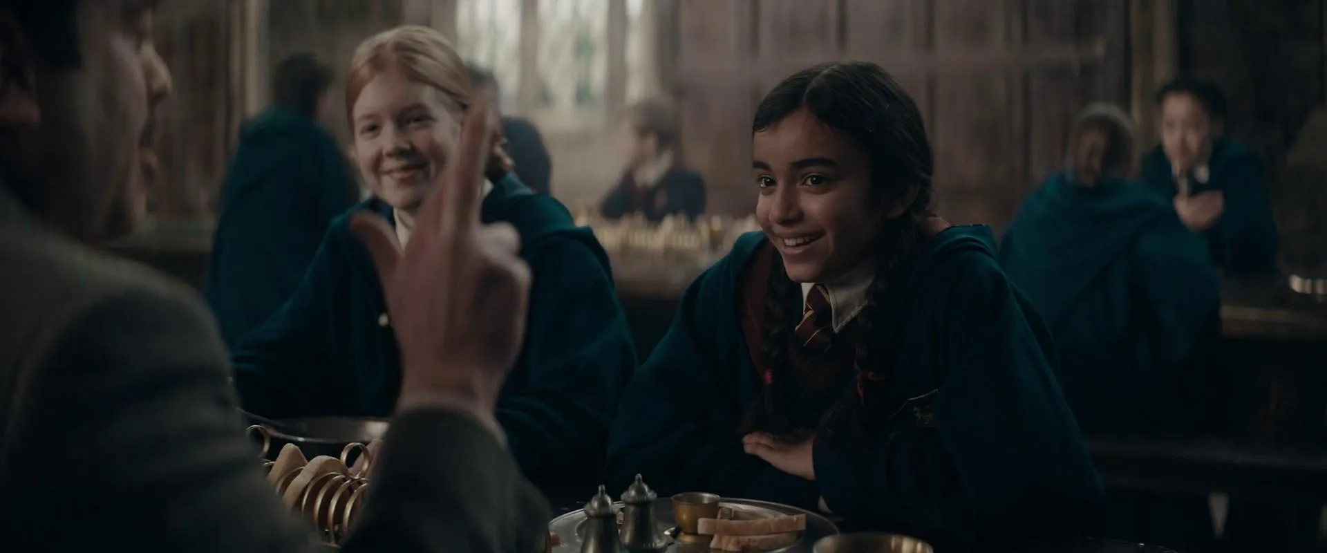 Radha Sthanakiya and Isabelle Coverdale in Fantastic Beasts: The Secrets of Dumbledore (2022)