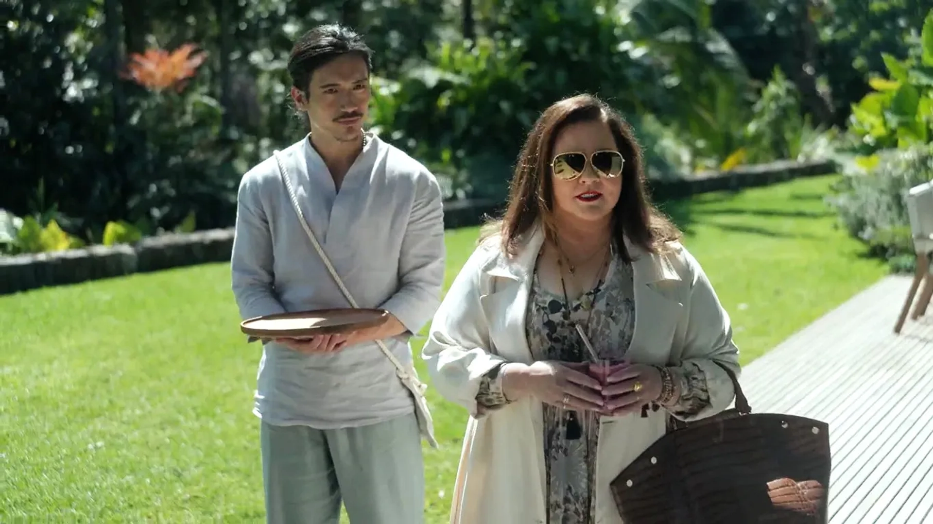 Melissa McCarthy and Manny Jacinto in Nine Perfect Strangers: Random Acts of Mayhem (2021)