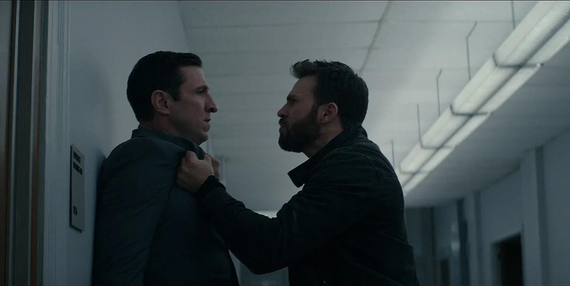 Chris Evans and Pablo Schreiber in Defending Jacob (2020)