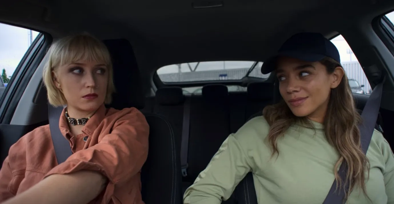 Lily Loveless and Hannah John-Kamen in The Stranger: Episode #1.5 (2020)