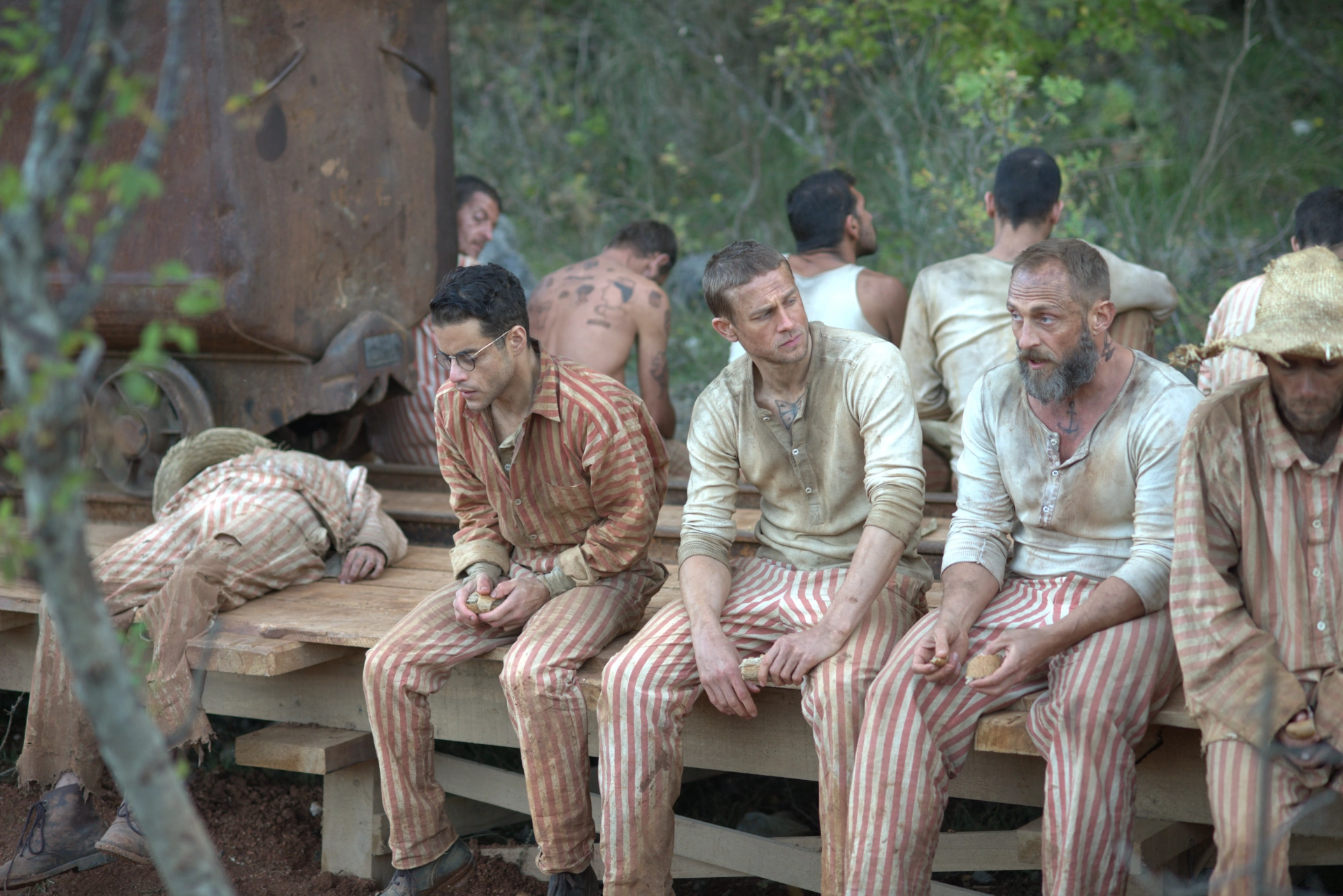 Charlie Hunnam, Rami Malek, and Roland Møller in Papillon (2017)