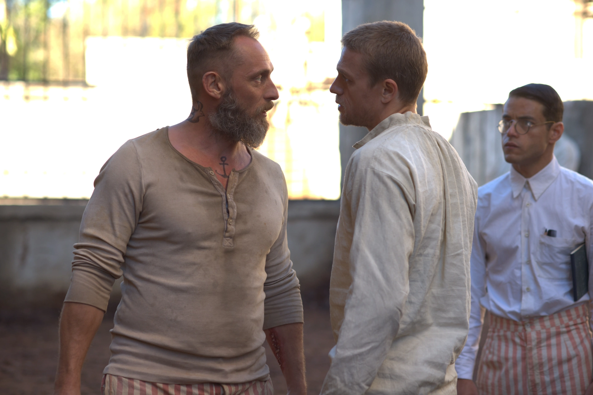 Charlie Hunnam, Rami Malek, and Roland Møller in Papillon (2017)