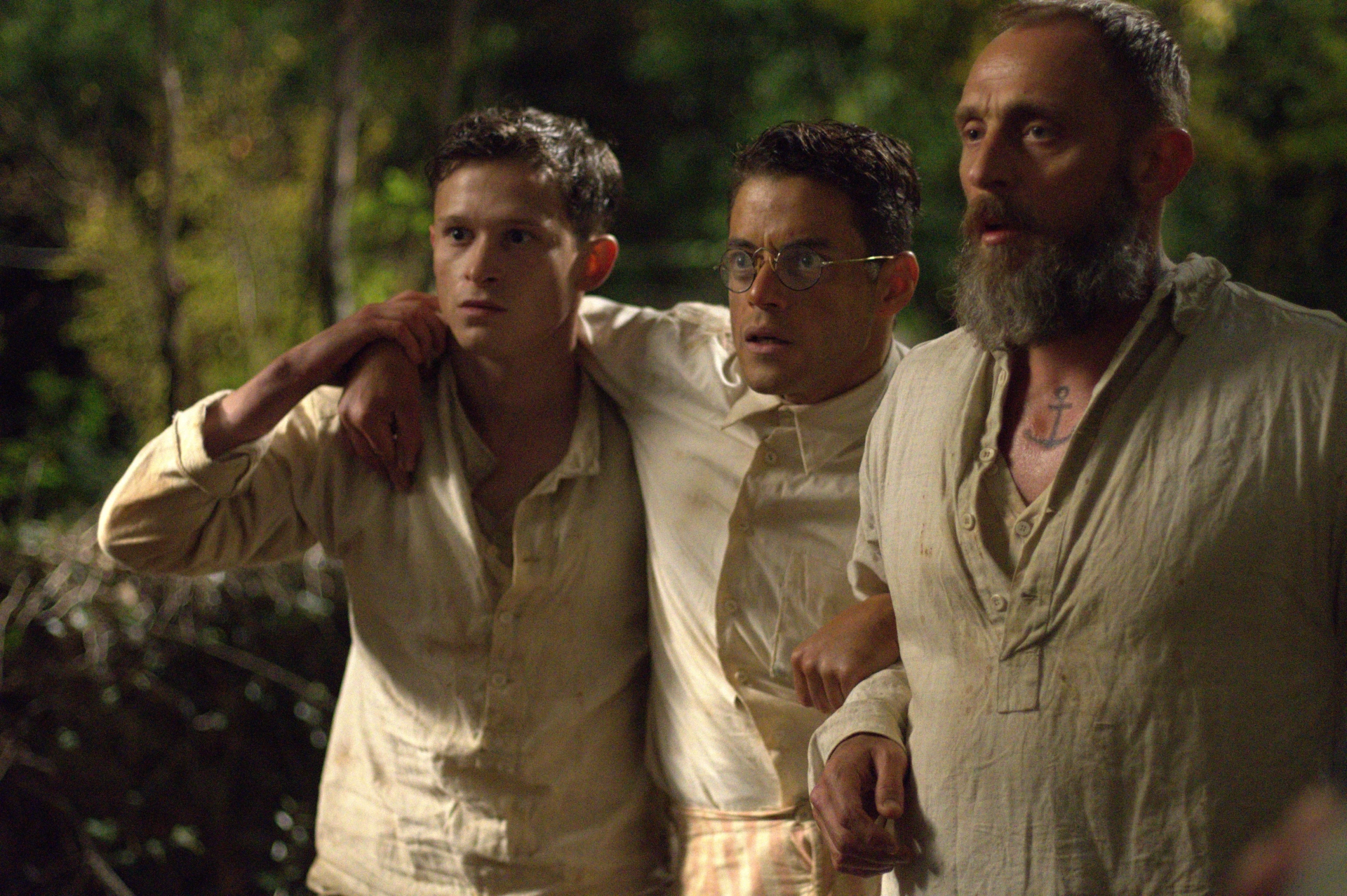 Rami Malek, Joel Basman, and Roland Møller in Papillon (2017)