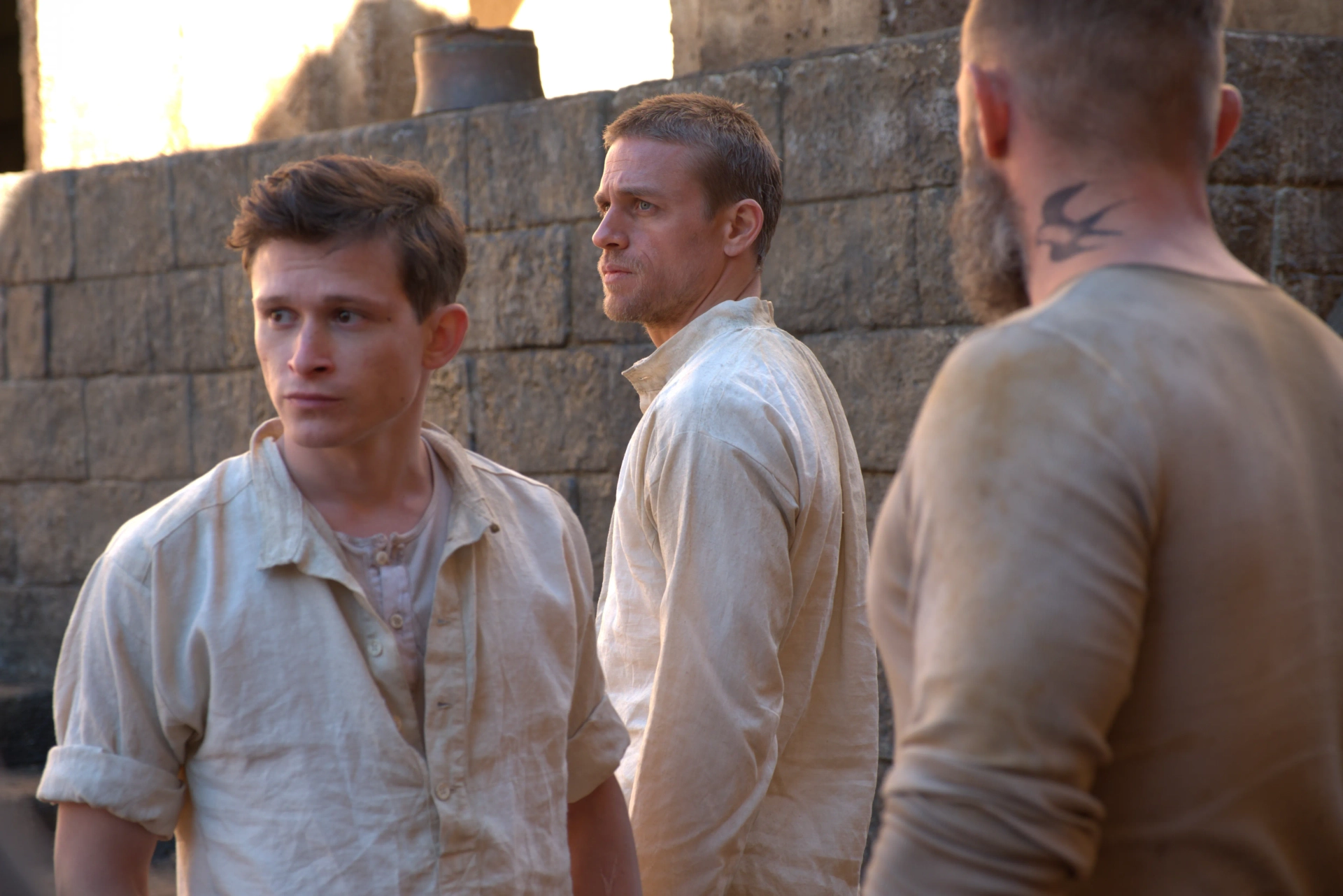 Charlie Hunnam, Joel Basman, and Roland Møller in Papillon (2017)