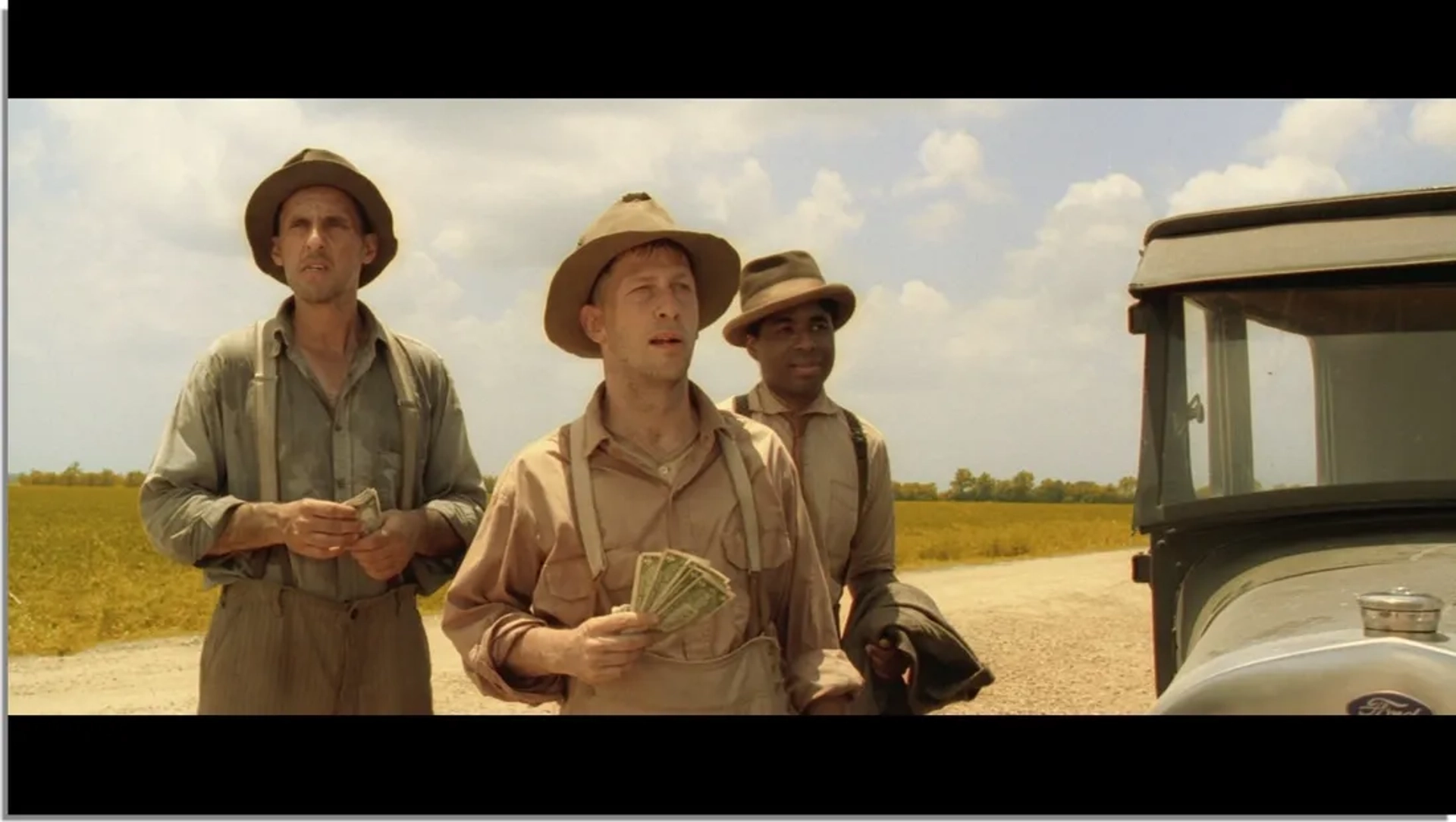 John Turturro, Chris Thomas King, and Tim Blake Nelson in O Brother, Where Art Thou? (2000)