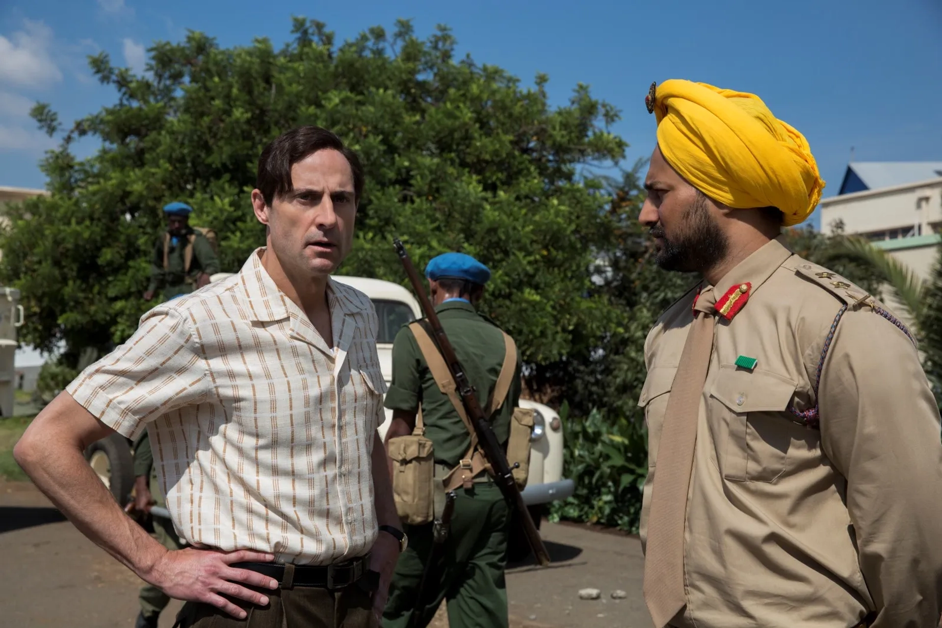 Mark Strong and Ashish Gangapersad in The Siege of Jadotville (2016)