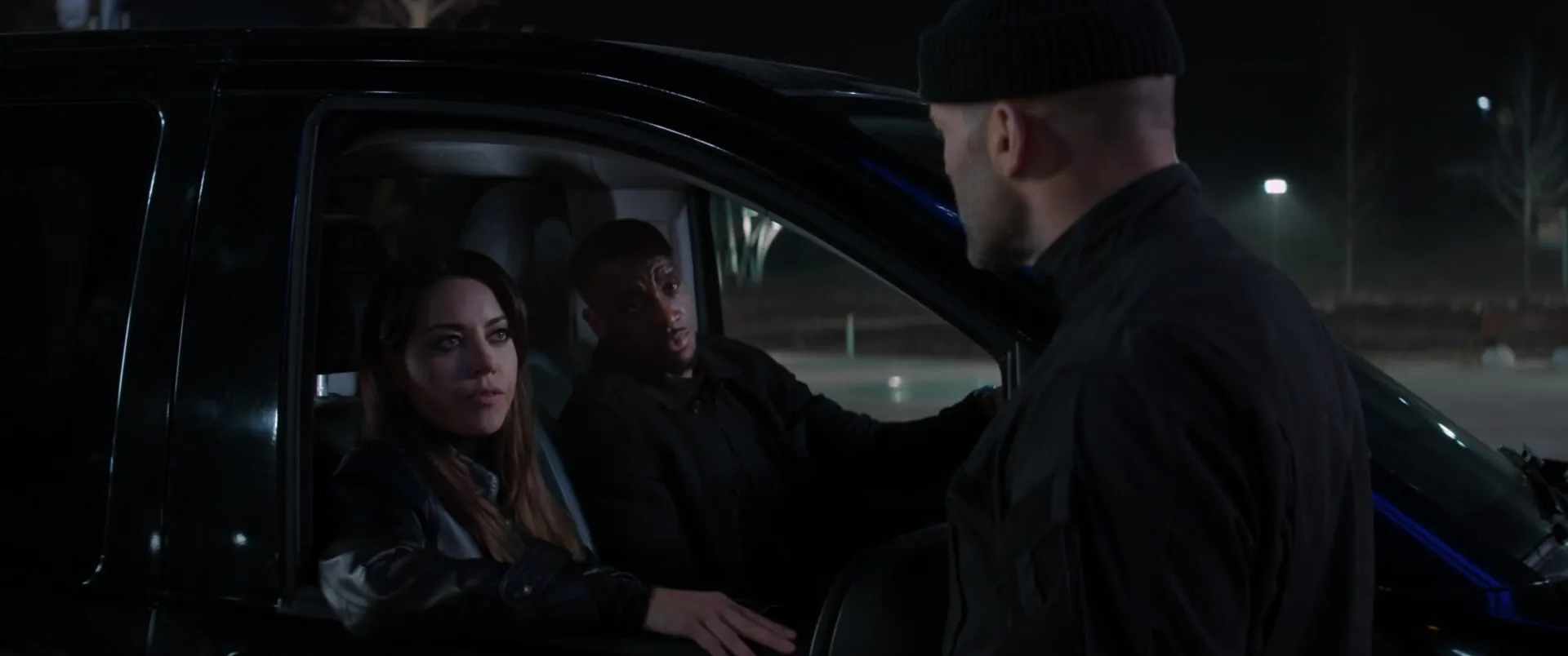 Jason Statham, Bugzy Malone, and Aubrey Plaza in Operation Fortune: Ruse de Guerre (2023)